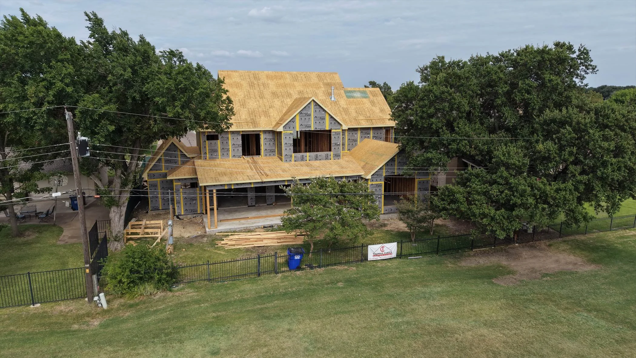 Rear exterior and covered patio under construction at 14231 Coral Harbour Cir in Dallas, Texas.