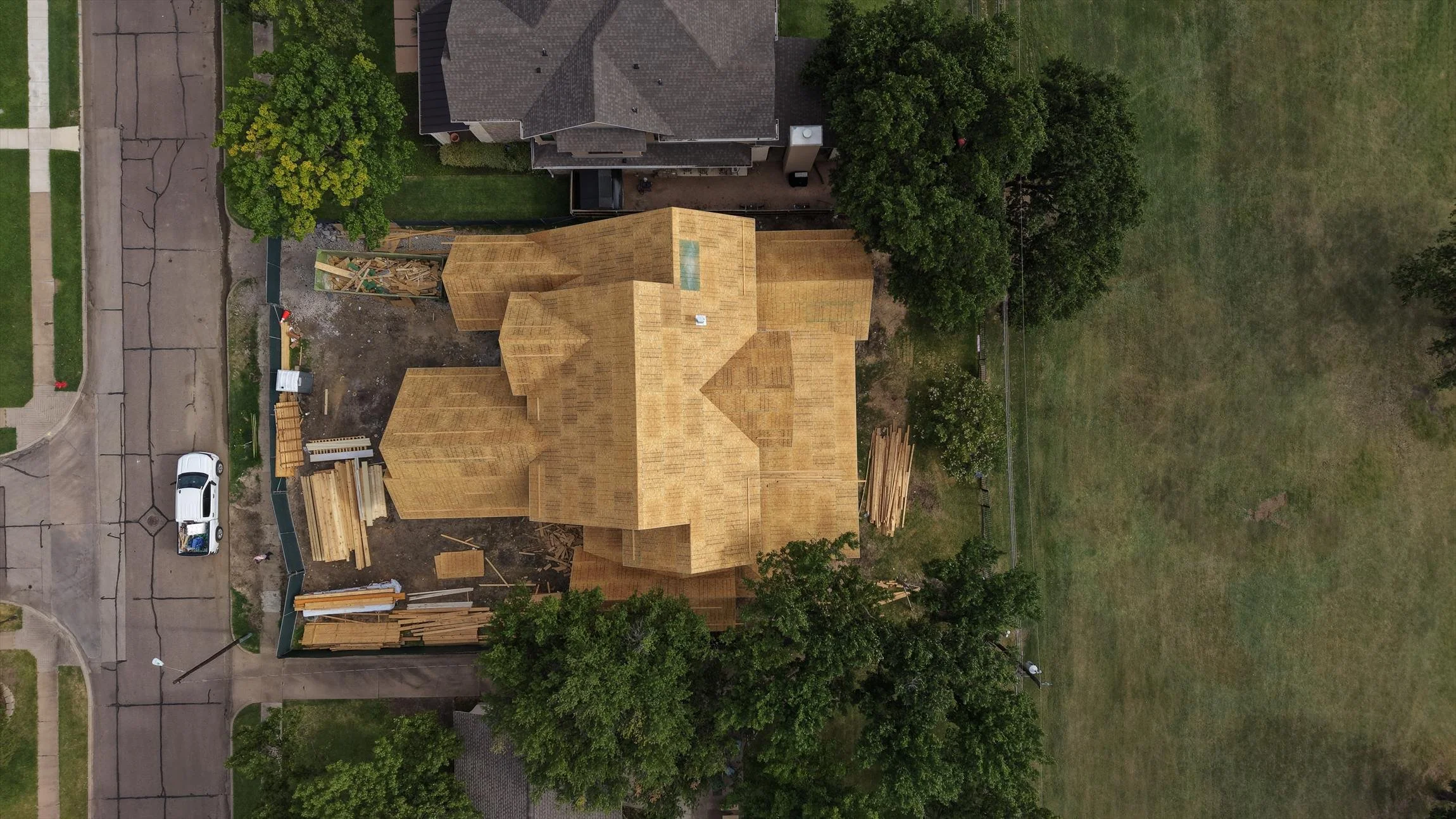 Front exterior and roof framing under construction at 14231 Coral Harbour Cir in Dallas, Texas.