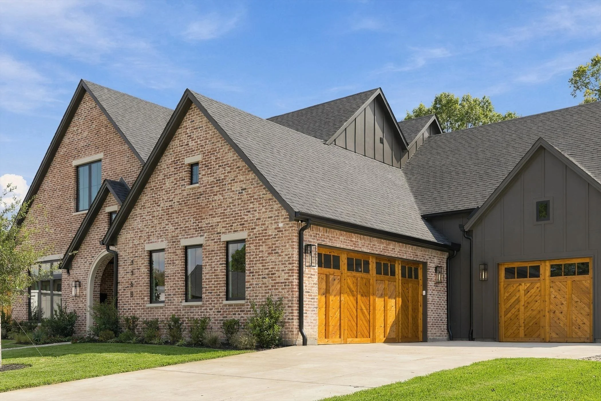 Front exterior and three-car garage at 3368 Dorado Beach Dr in Dallas, Texas.