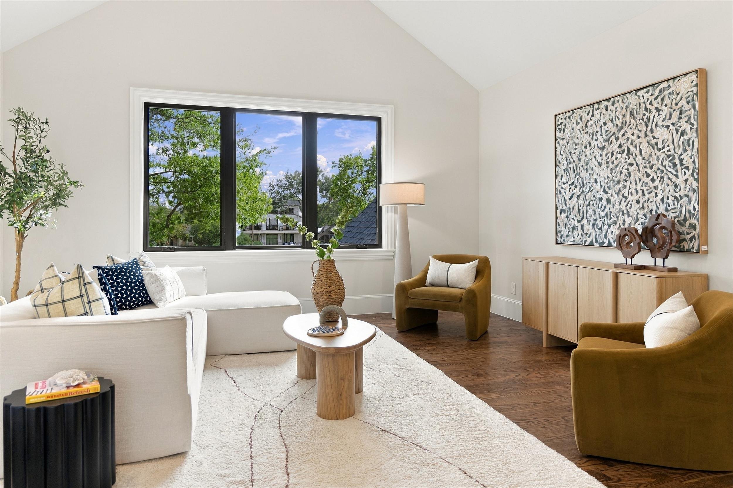 Sitting room with large window and lounge seating at 3368 Dorado Beach Dr in Dallas, Texas.