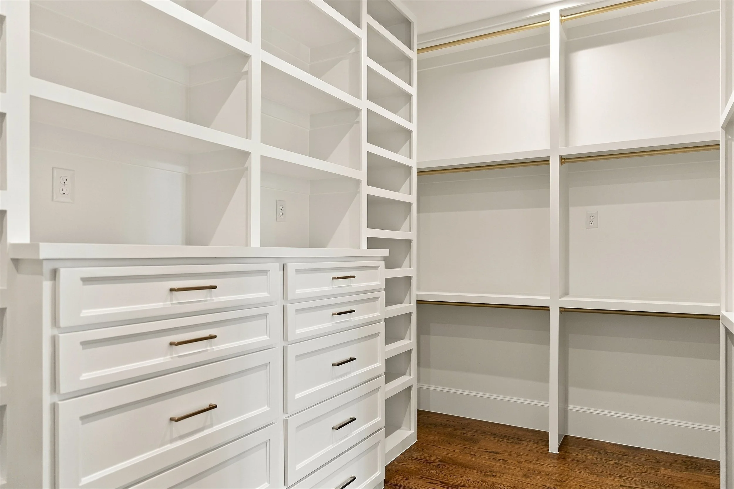 Walk-in closet with built-in drawers and shelves at 3368 Dorado Beach Dr in Dallas, Texas.