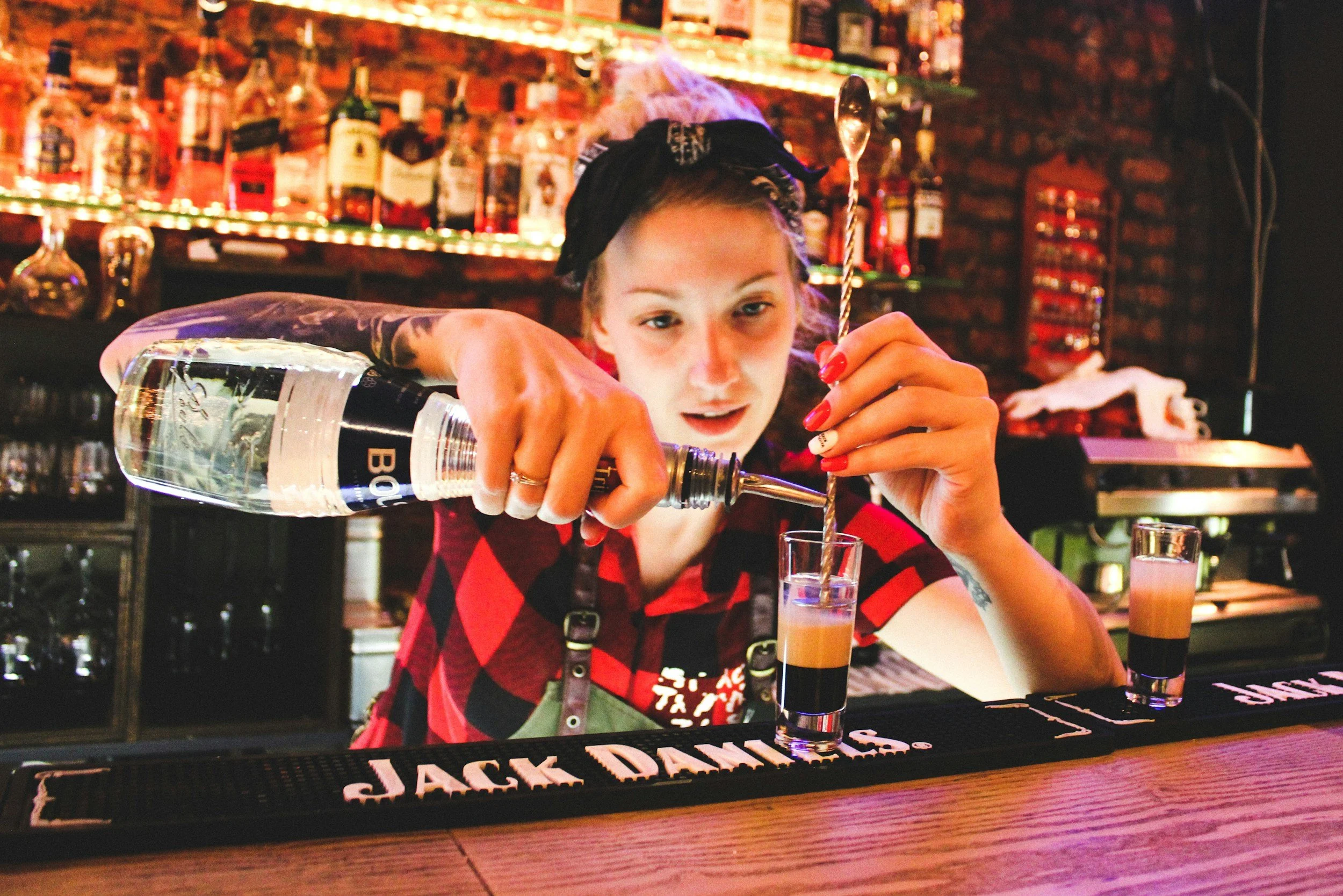 Girl pouring a shot