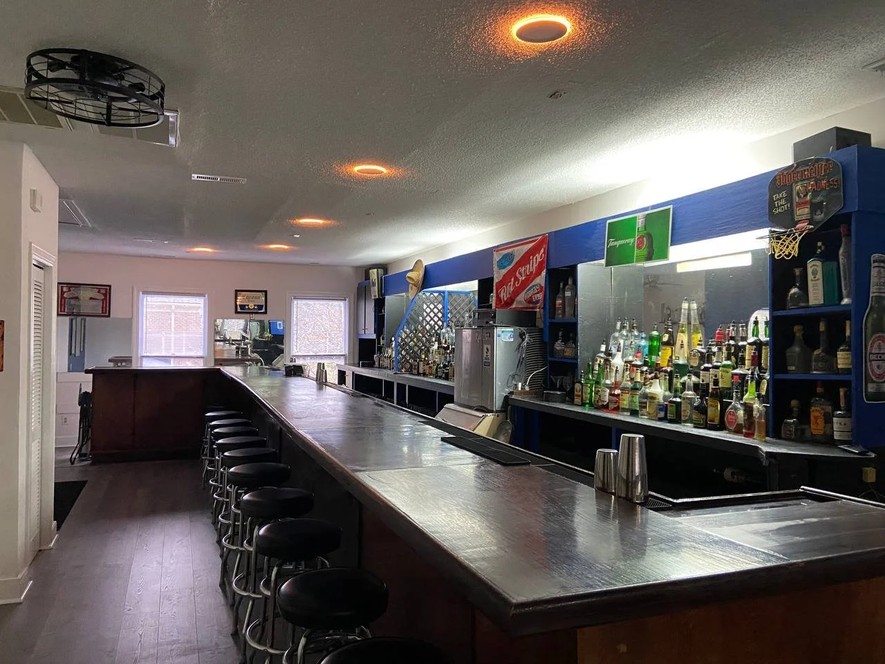 Wide view of the finished training bar with stools along the full length of the rail.