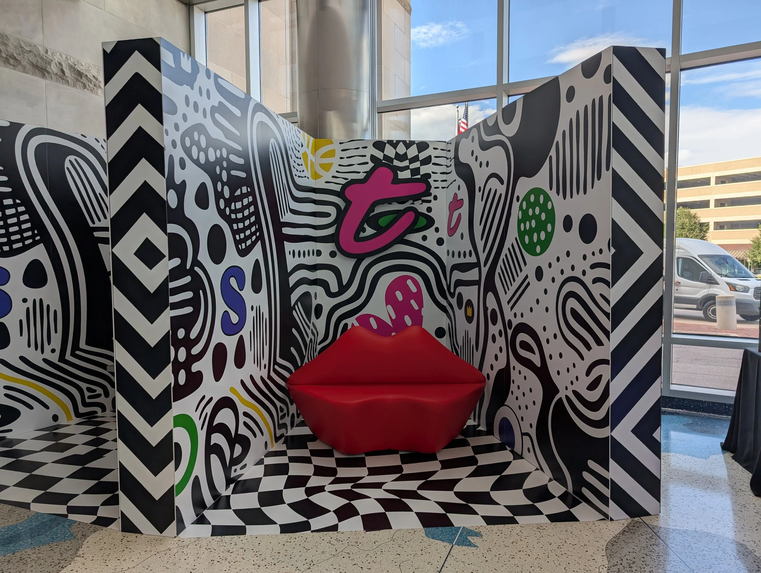 Photo box with red lip chair.