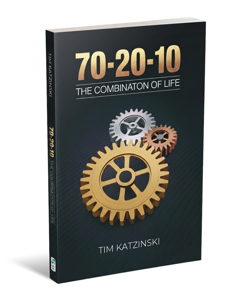 Book titled "70-20-10: The Combination of Life" by Tim Katzinski, featuring three interlocking gears on the cover.