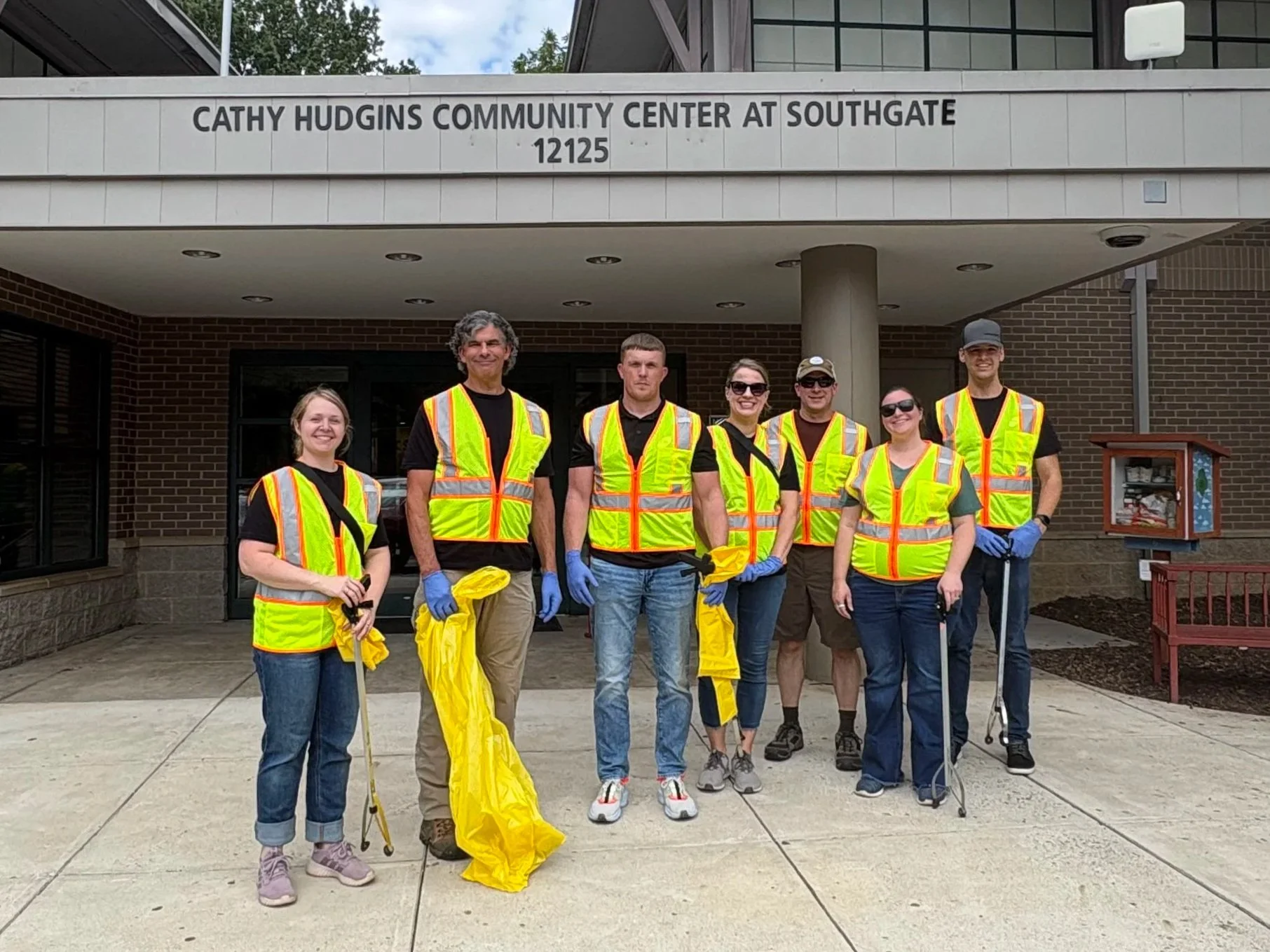 A photo of our staff outside the Cathy Hudgins Community Center in Reston, VA before our cleanup.
