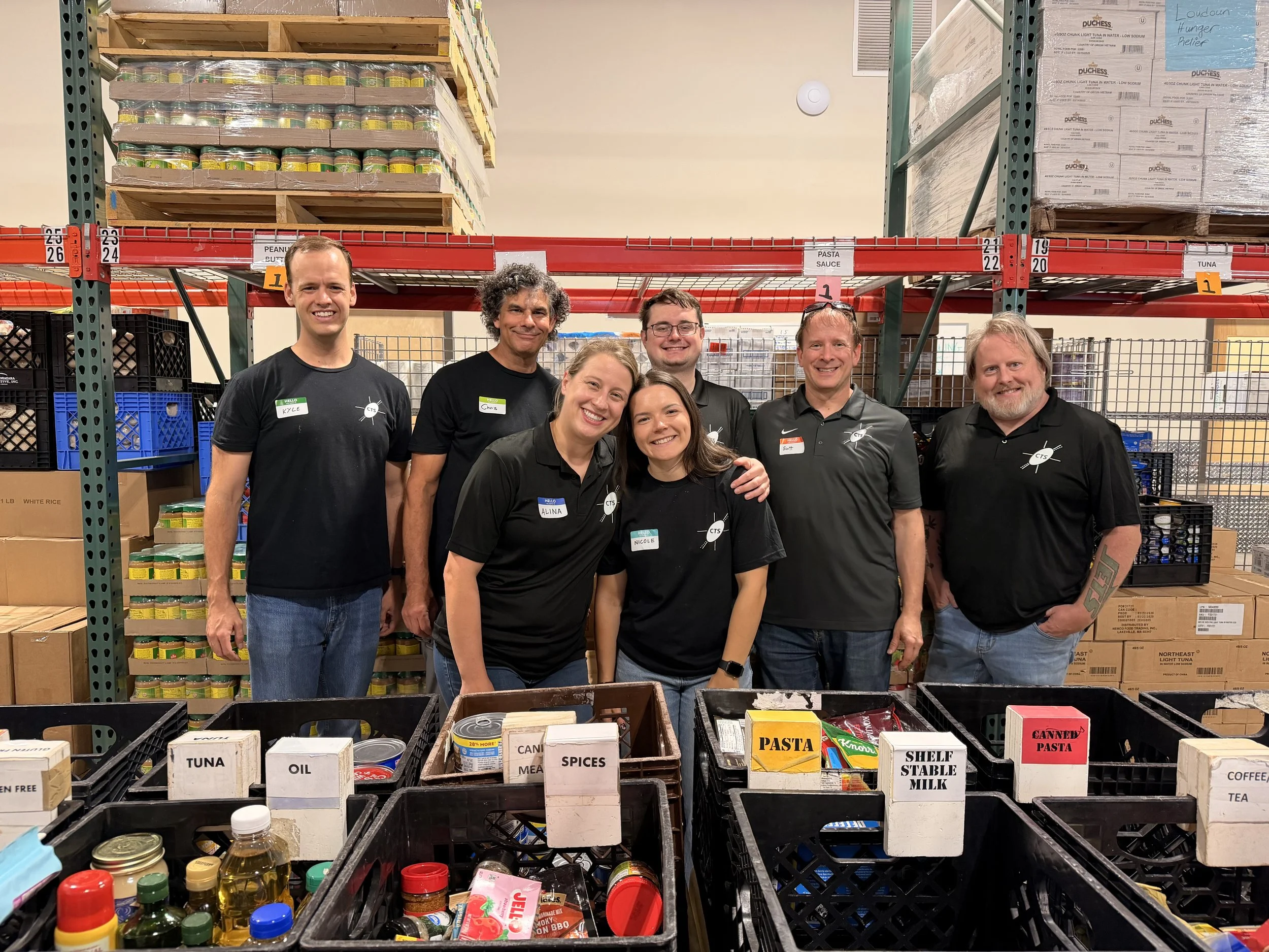 A photo of our staff after their volunteer shift at Loudoun Hunger Relief.