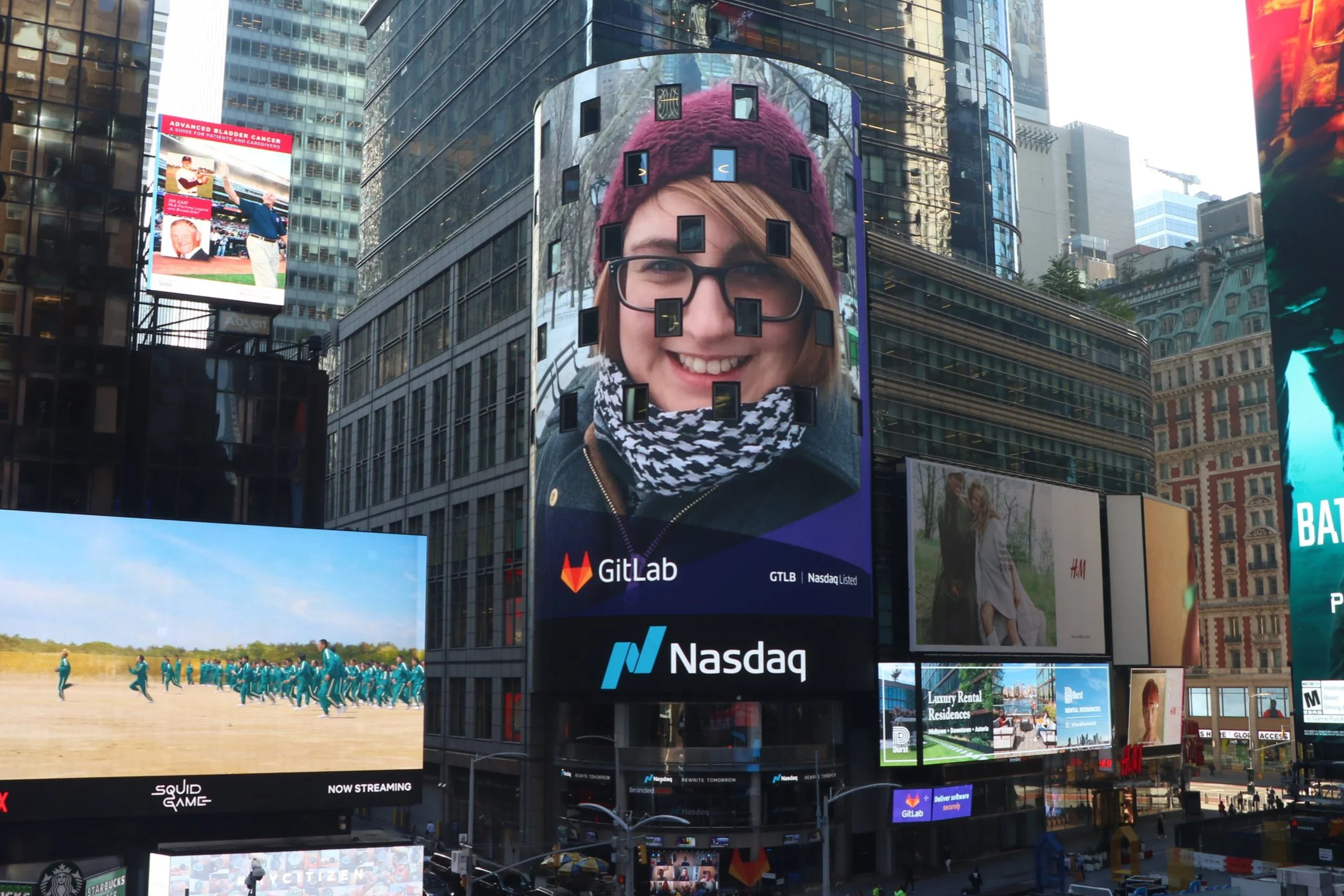 Vic Bell featured on the Nasdaq digital billboard in Times Square, New York, celebrating GitLab's IPO in 2021.