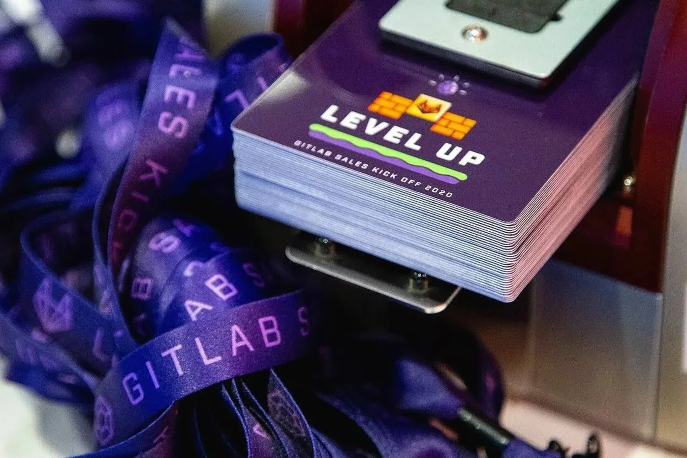 GitLab Level Up 2020 event badge featuring a colourful, retro video game-inspired design with the GitLab fox logo, pixel graphics and a glowing crystal.