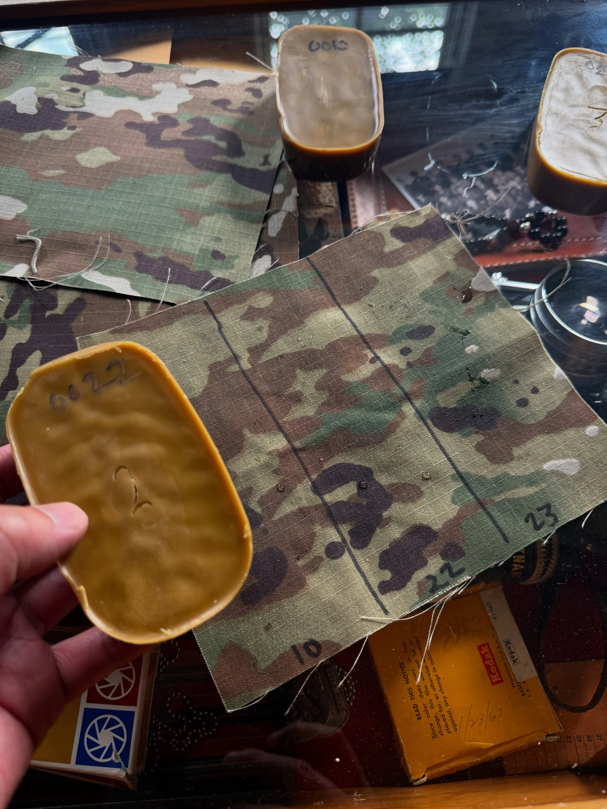 WAX FORMULA 0010 / 0023

Before waterproof sprays and synthetic coatings, soldiers, outdoorsmen, and laborers relied on waxes, oils, and heavy canvas to protect uniforms and gear from rain, mud, and field conditions.

Testing early wax formulations o