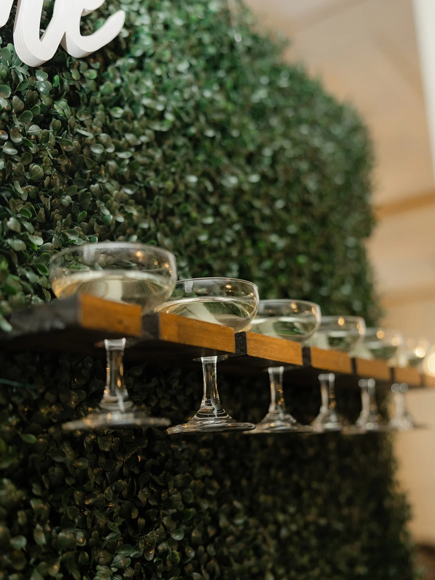 Champagne anyone? 🥂

Lined with coup glasses, our champagne wall is a unique way to kick off the celebration with your guests. Grab a glass and cheers to the newlyweds!

Photographer: @shelbybecklerphotography 
Florist: @viivifloralstudio 
Catering: