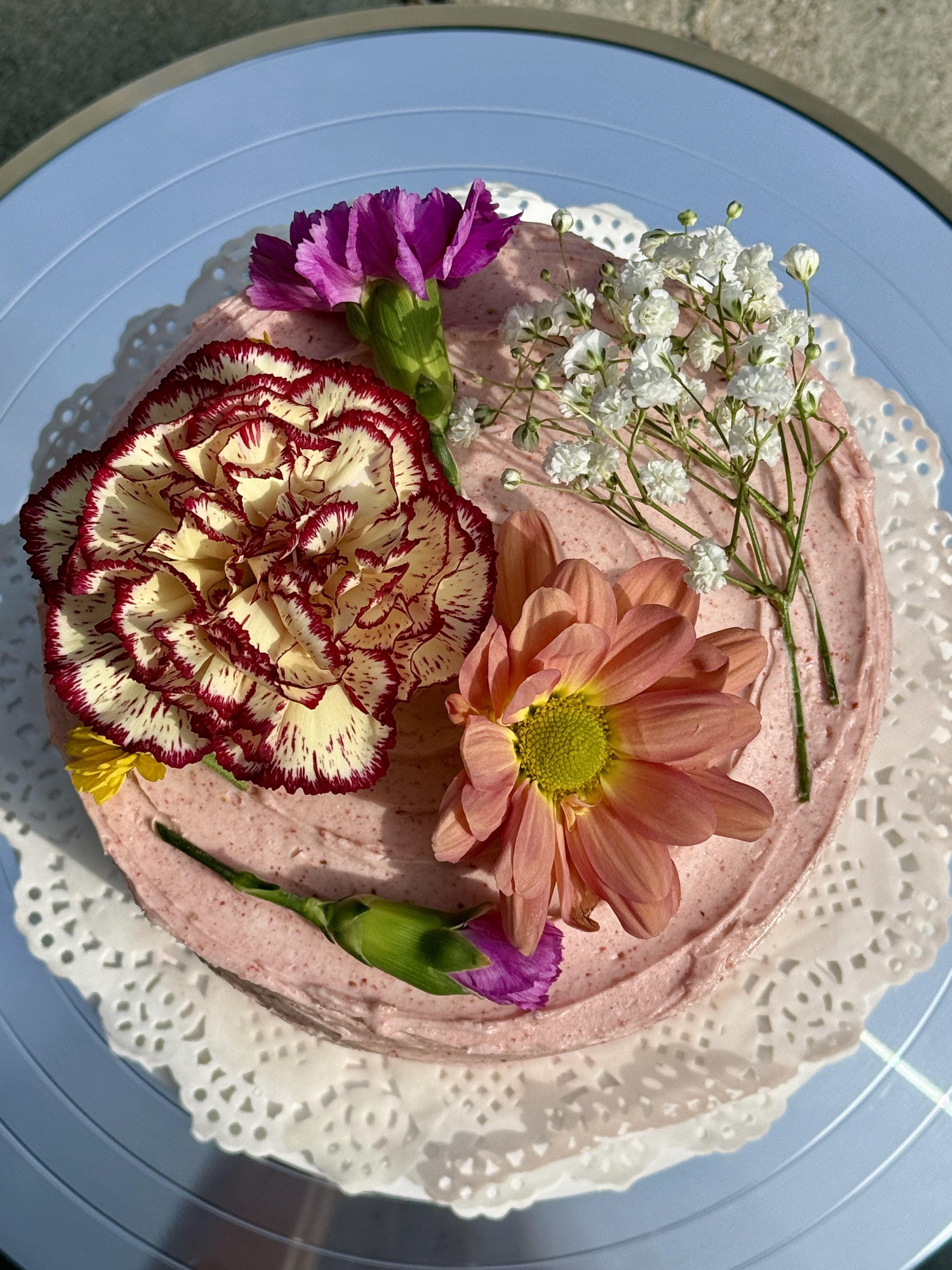 vanilla bean sponge swirled with raspberry puree, filled with fresh berries & strawberry SMBC