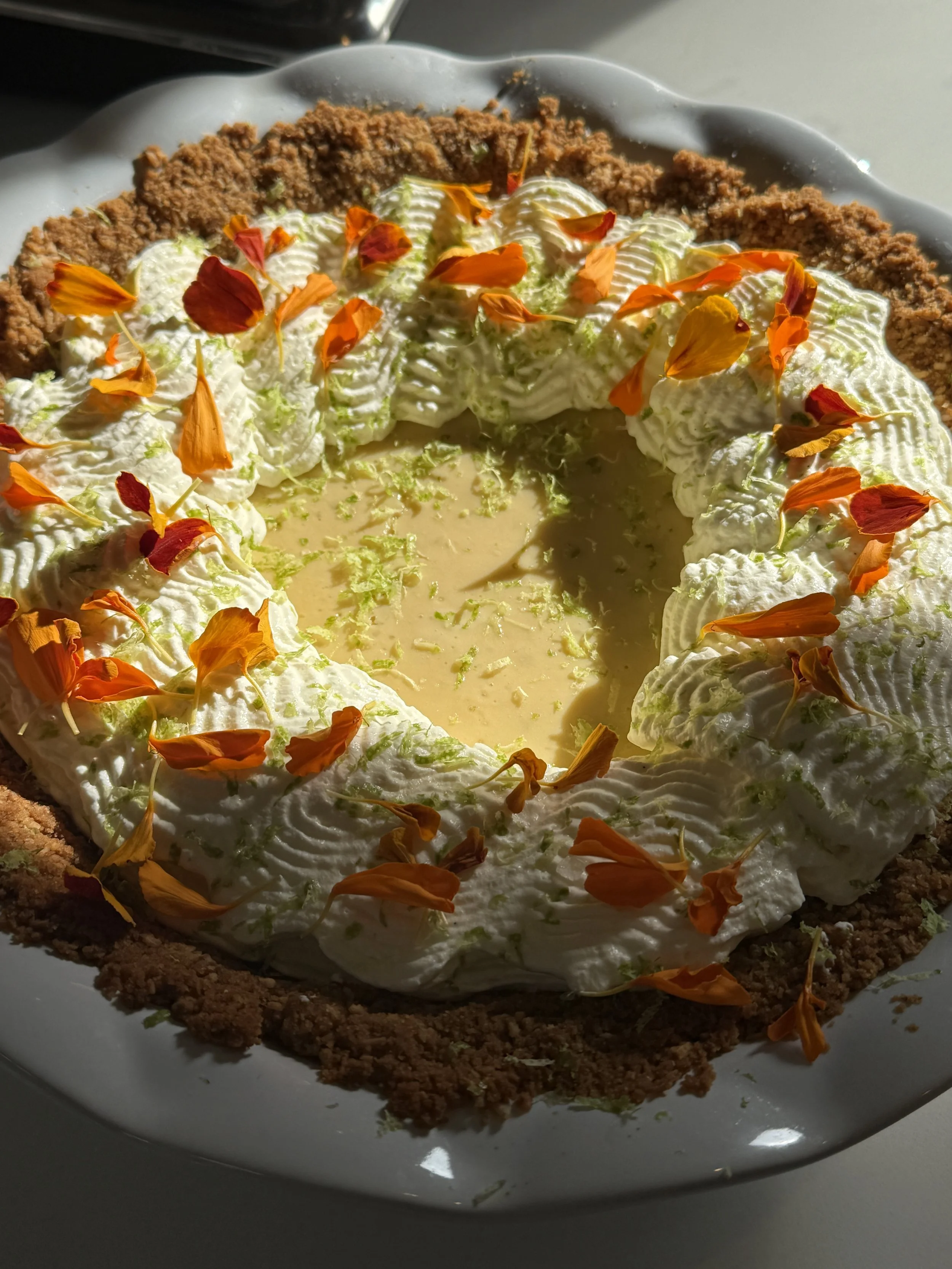 key lime pie with toasted coconut brown butter graham cracker crust & fresh whipped cream