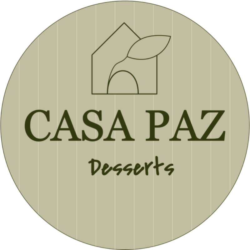 Logo for Casa Paz Desserts featuring a house with a leaf above it, and text in green that says 'Casa Paz Desserts' on a beige background.