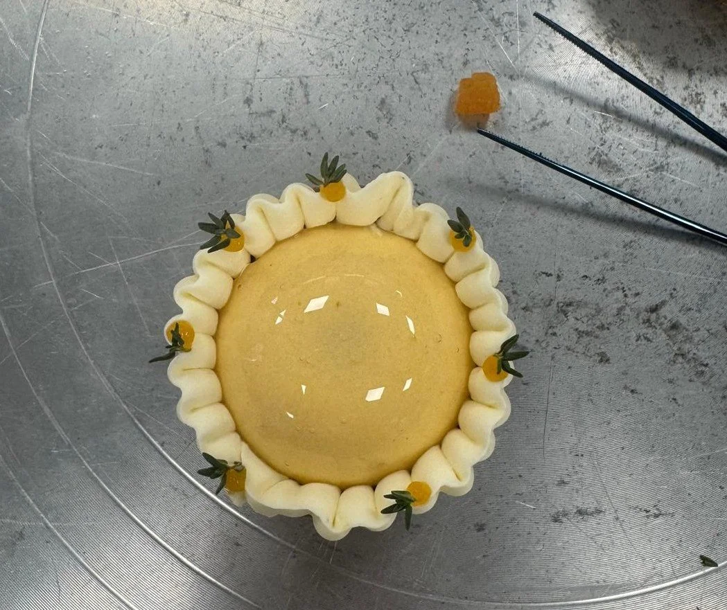 Apricot thyme tarlet, sitting on a metallic surface.