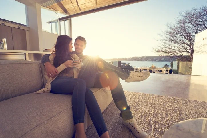 A young couple having conversation and enjoying one another's company.
