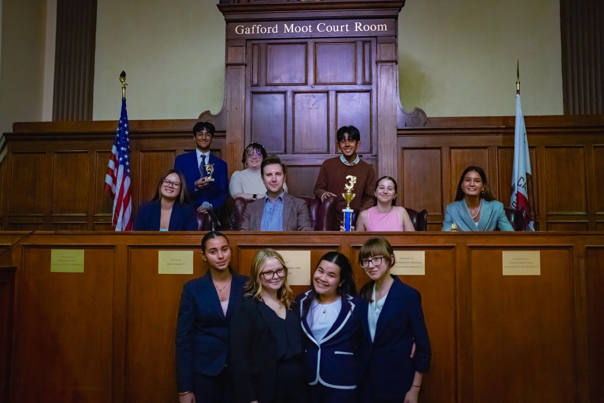 A high school mock trial team poses together after completing their mock trial tournament. The SoCal Mock Trial League hosts high school mock trial tournaments across Southern California.