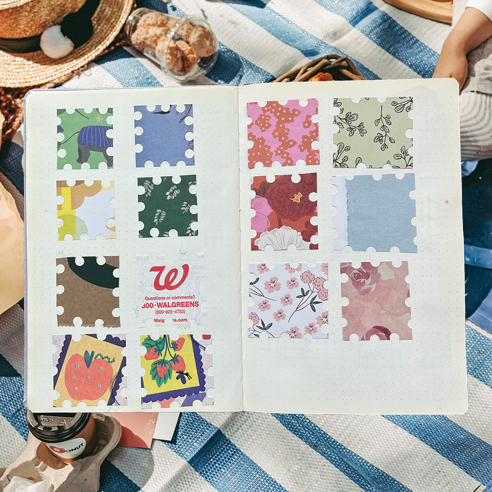 an open journal with scrap paper cut into stamps on both pages