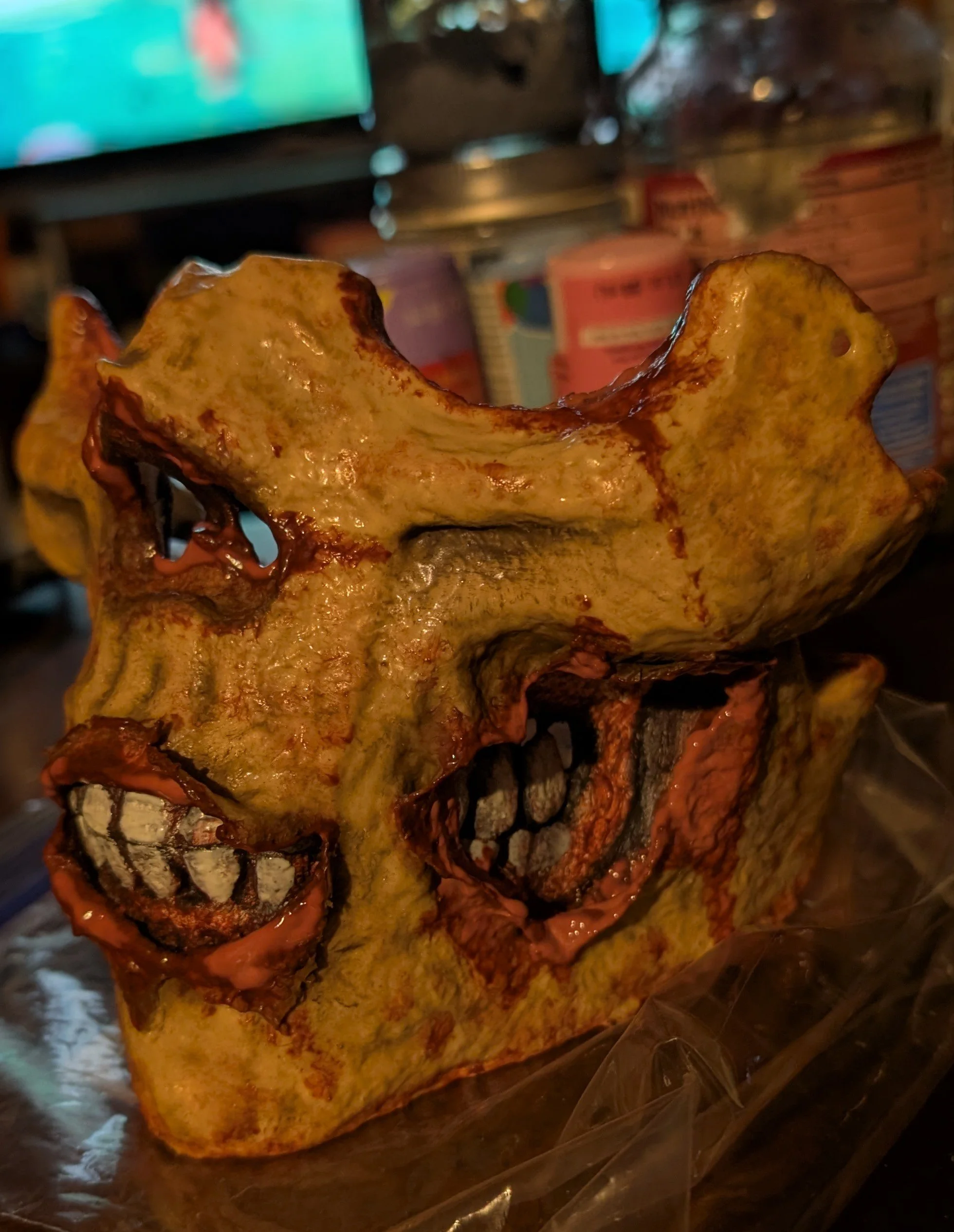 A Zombie Half-mask made by Deader Homes and Graveyards.