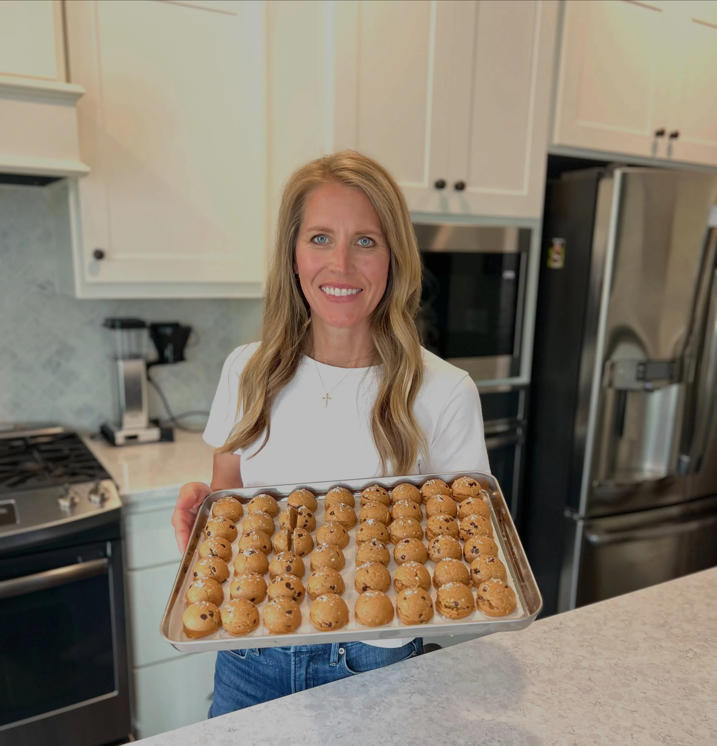 Hi, I&rsquo;m Kelli 👋🏻

I&rsquo;m a wife, mom of three, health + fitness lover, lifelong baker, and the heart behind this new little protein bite business.

For 13 years, I worked in the corporate world. Then, in the summer of 2025, I was unexpecte