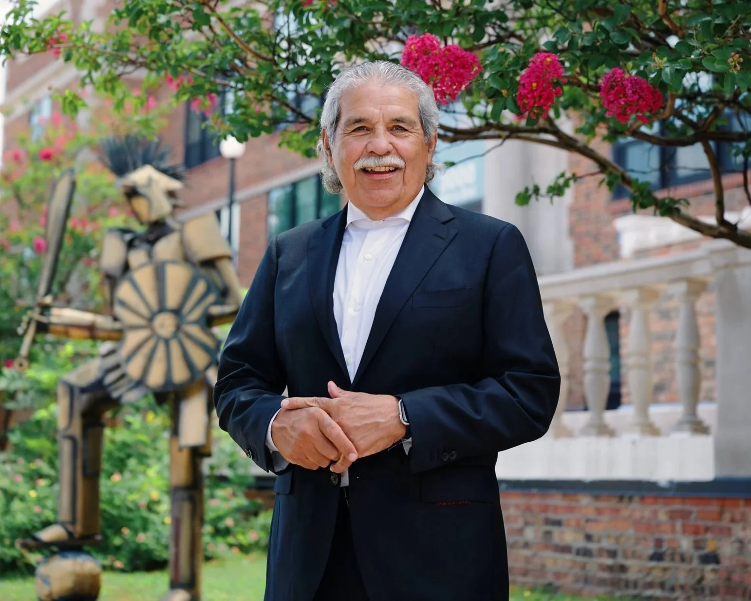 Dr. Michael Hinojosa stands in front of James Madison High School in Dallas, Texas