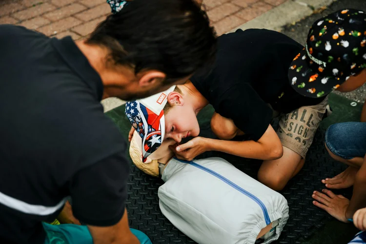 Hands-on CPR and AED certification practice with feedback manikins
