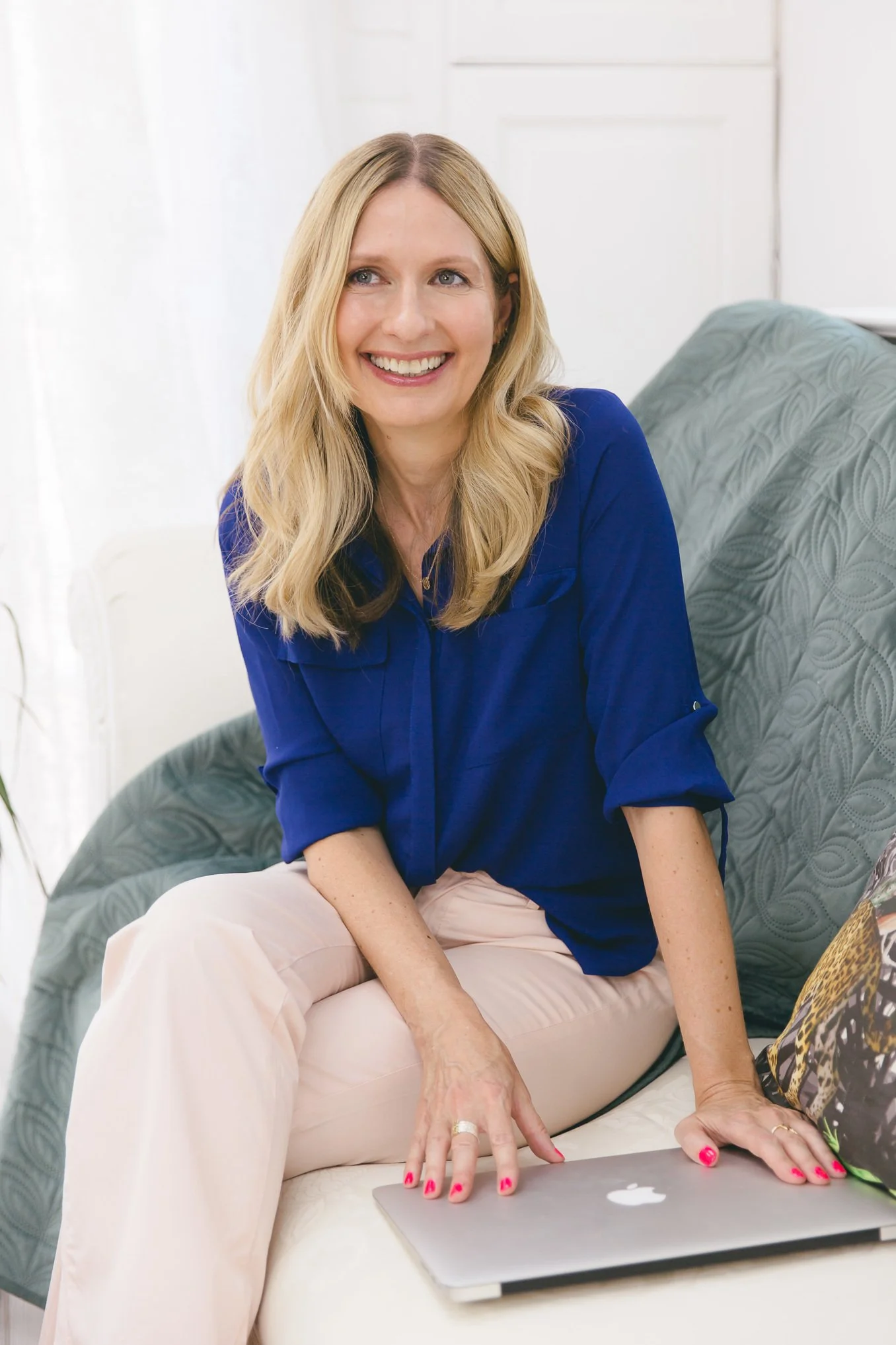 Michelle White smiling in a bright, contemporary workspace