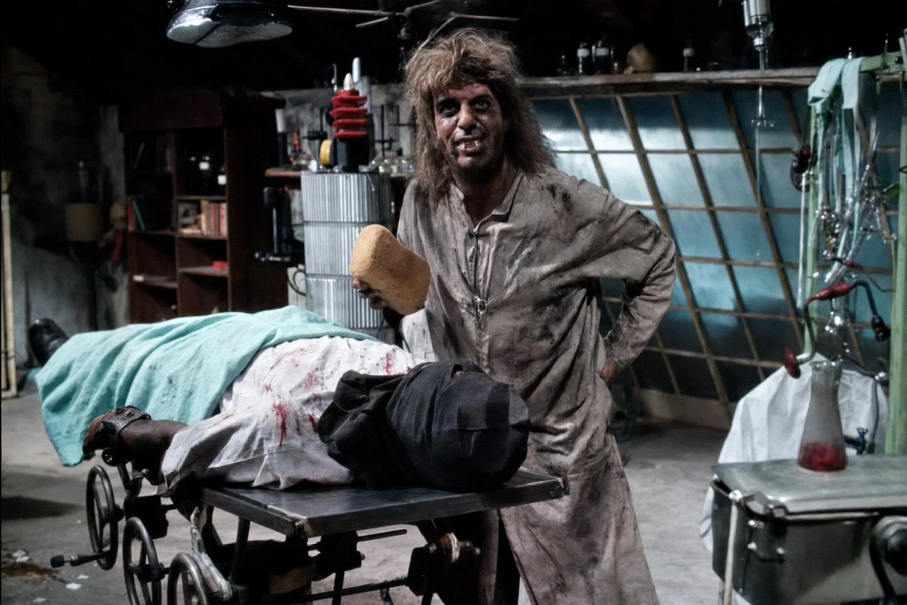 Morgus stands beside a covered test subject in his laboratory during the 1961 “Artificial Heart” television experiment.
