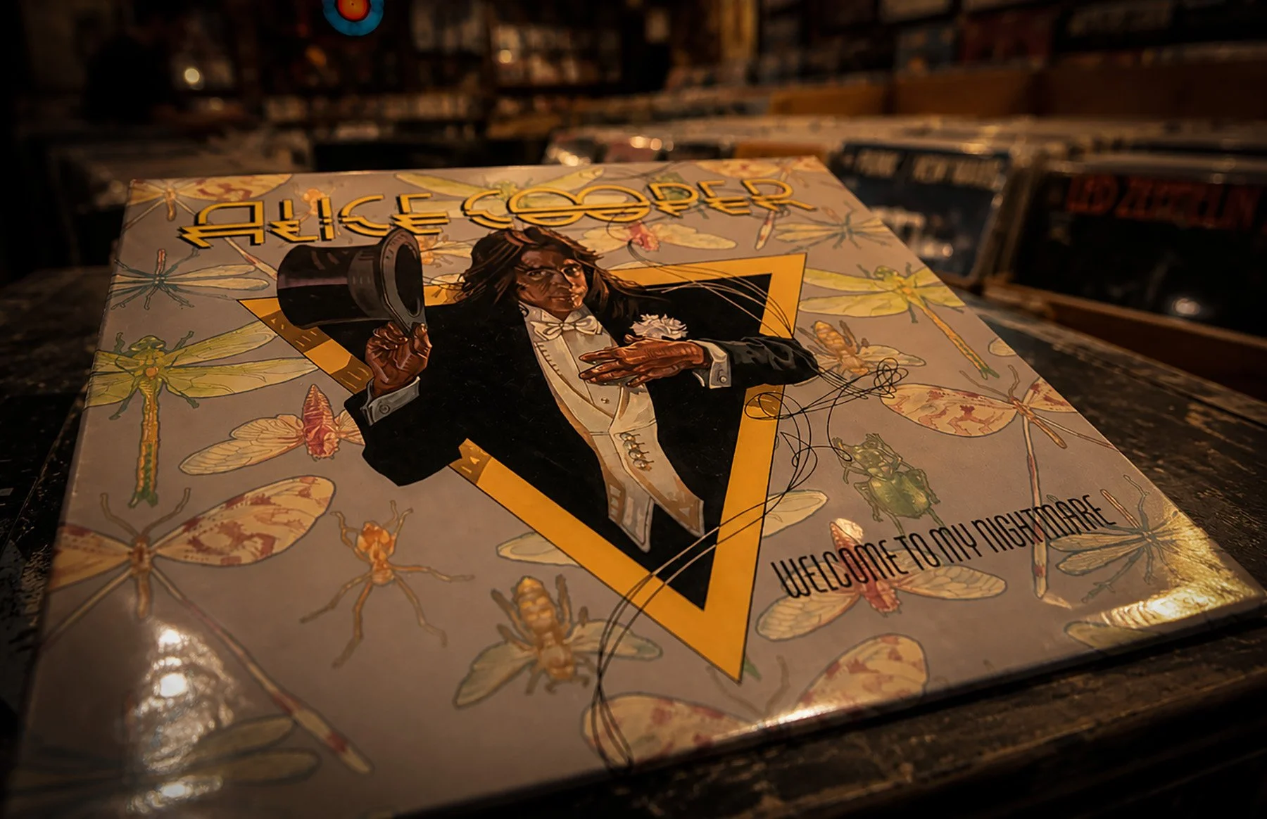 Vintage copy of Alice Cooper’s 1975 album Welcome to My Nightmare displayed in a used record store setting.