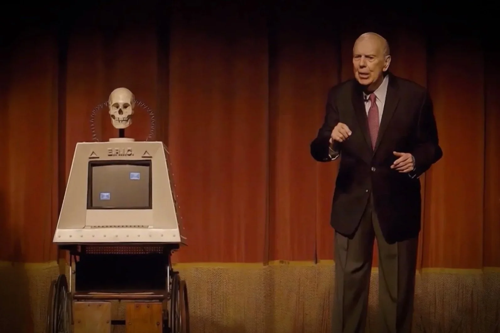 Sid Noel speaks beside the skull-topped E.R.I.C. computer during his 2019 one-man show at the Orpheum Theater in New Orleans.