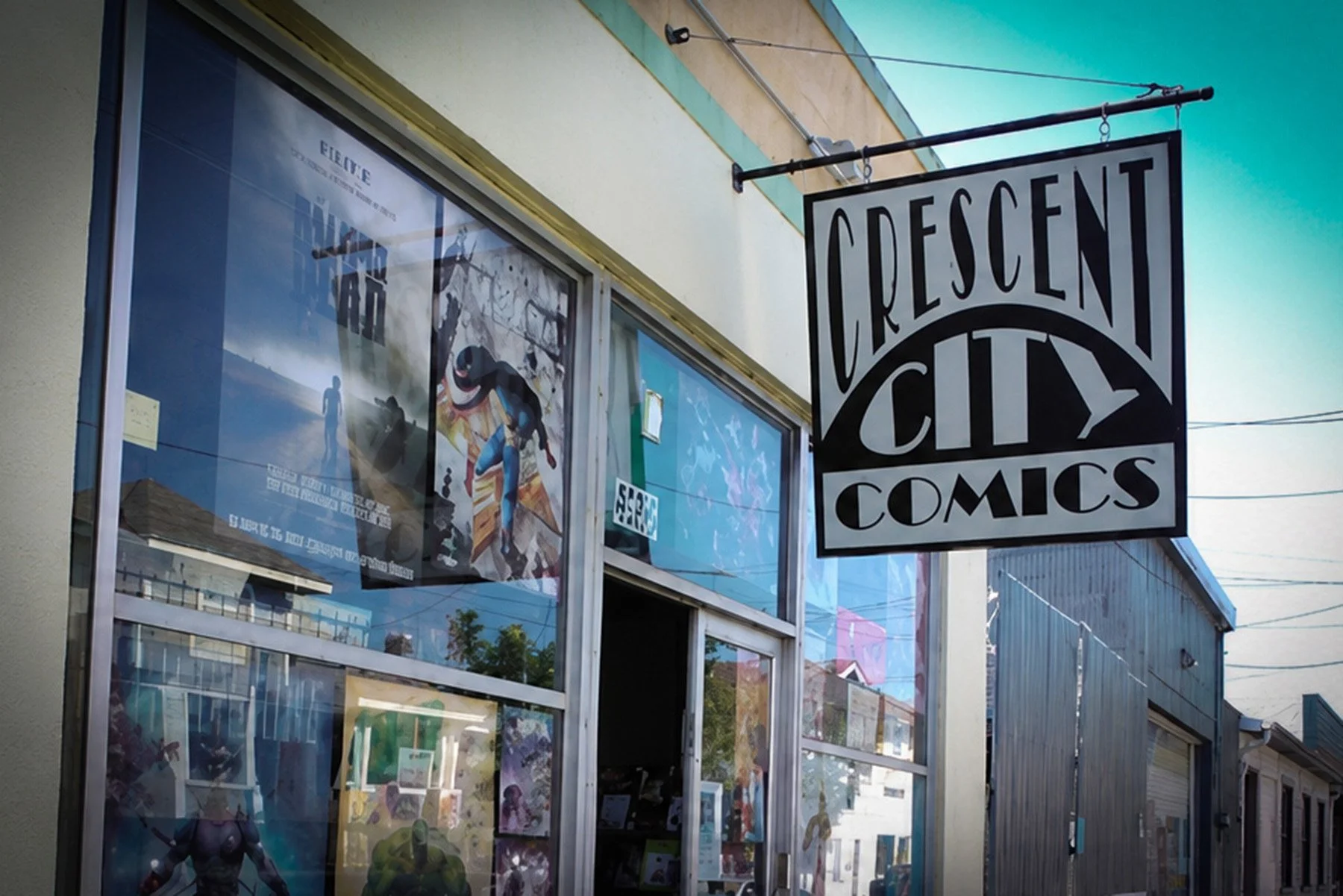 Crescent City Comics storefront and hanging sign at 4916 Freret Street in New Orleans.