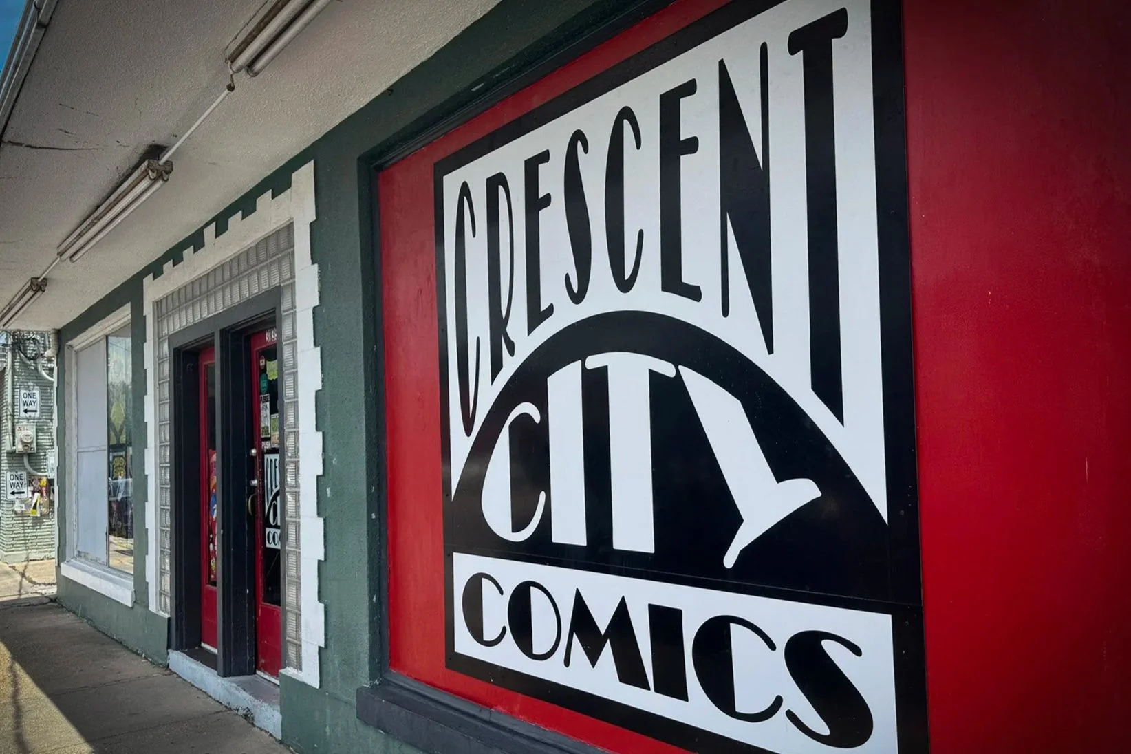 Crescent City Comics storefront on Calhoun Street in New Orleans on a sunny day.
