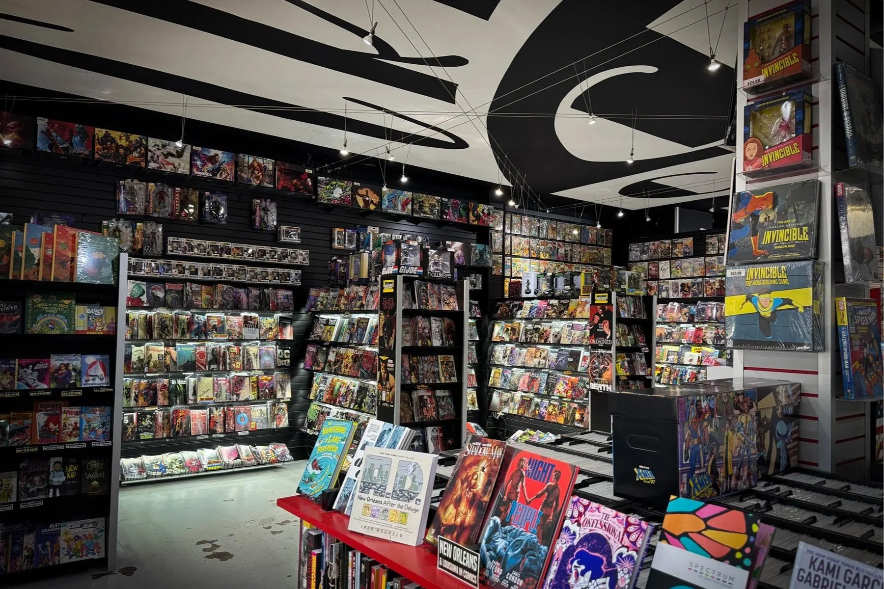 Shelves of comics, graphic novels and manga inside Crescent City Comics on Calhoun Street in New Orleans.