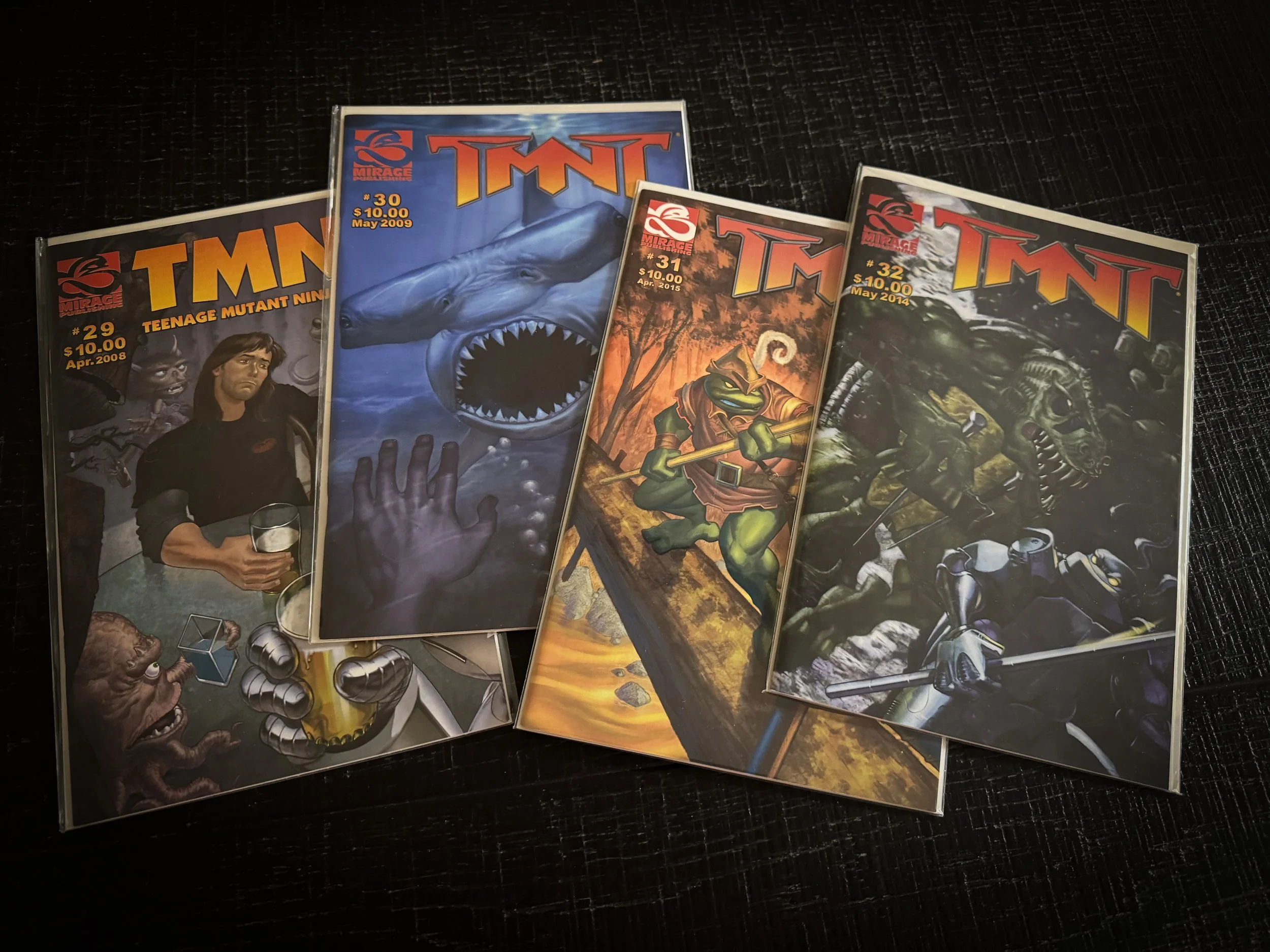 TMNT Volume 4 issues #29, #30, #31 and #32 from Mirage Comics displayed together.