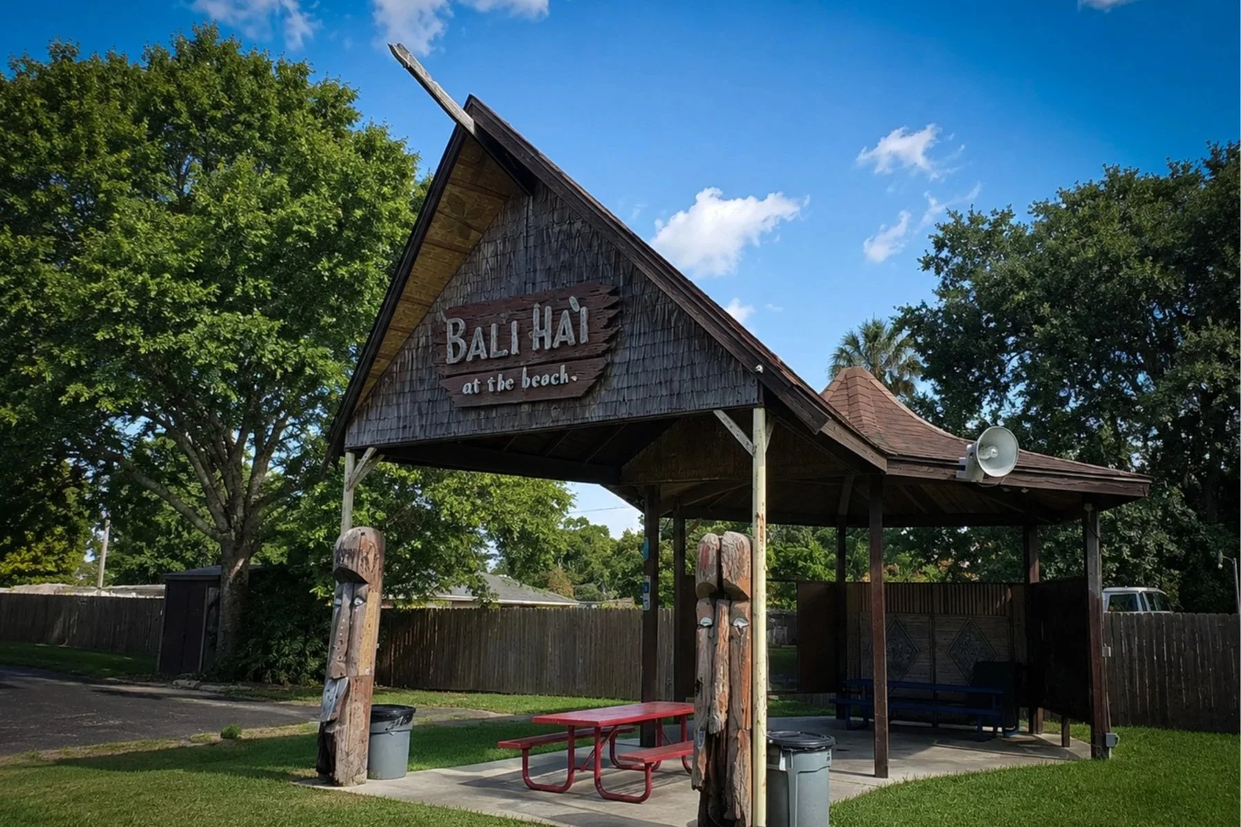 Former Bali Ha'i restaurant structure from Pontchartrain Beach preserved in Rivertown, featuring its distinctive Polynesian-inspired roofline and carved tiki posts.
