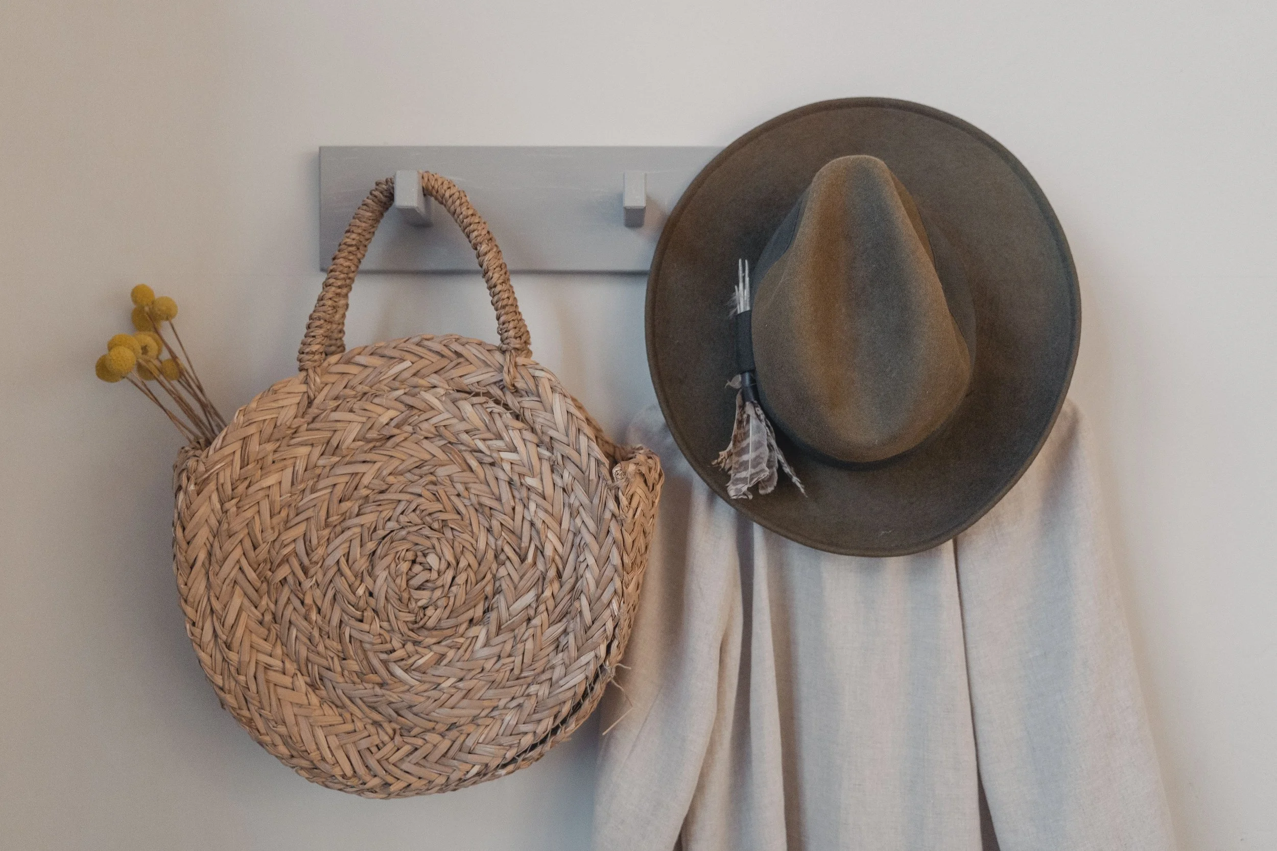 Wall Hooks or a Peg Rail to hang hats, coats or umbrella on in an entryway