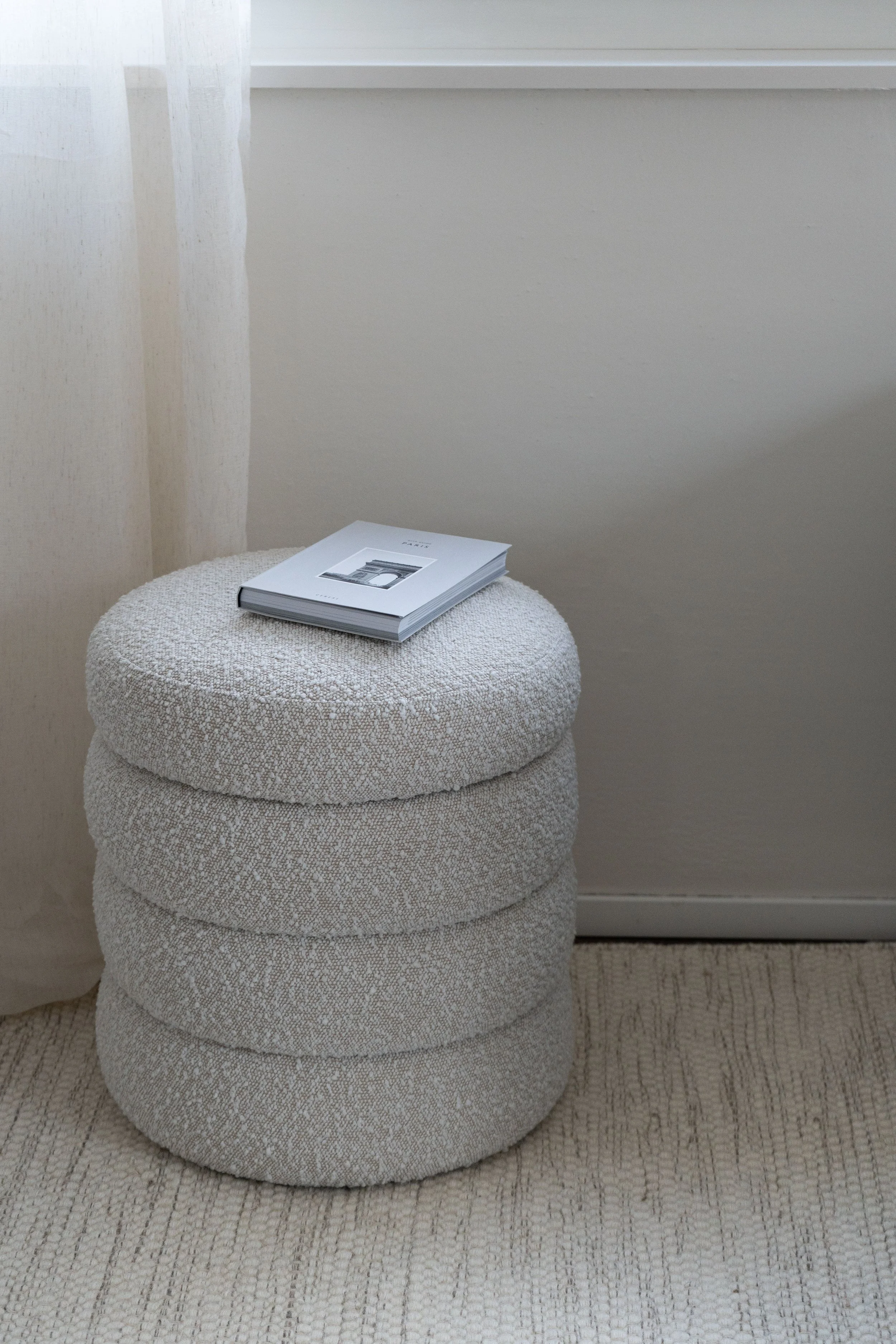 Ottoman with removable lid for hidden storage for blankets, pillows or books.