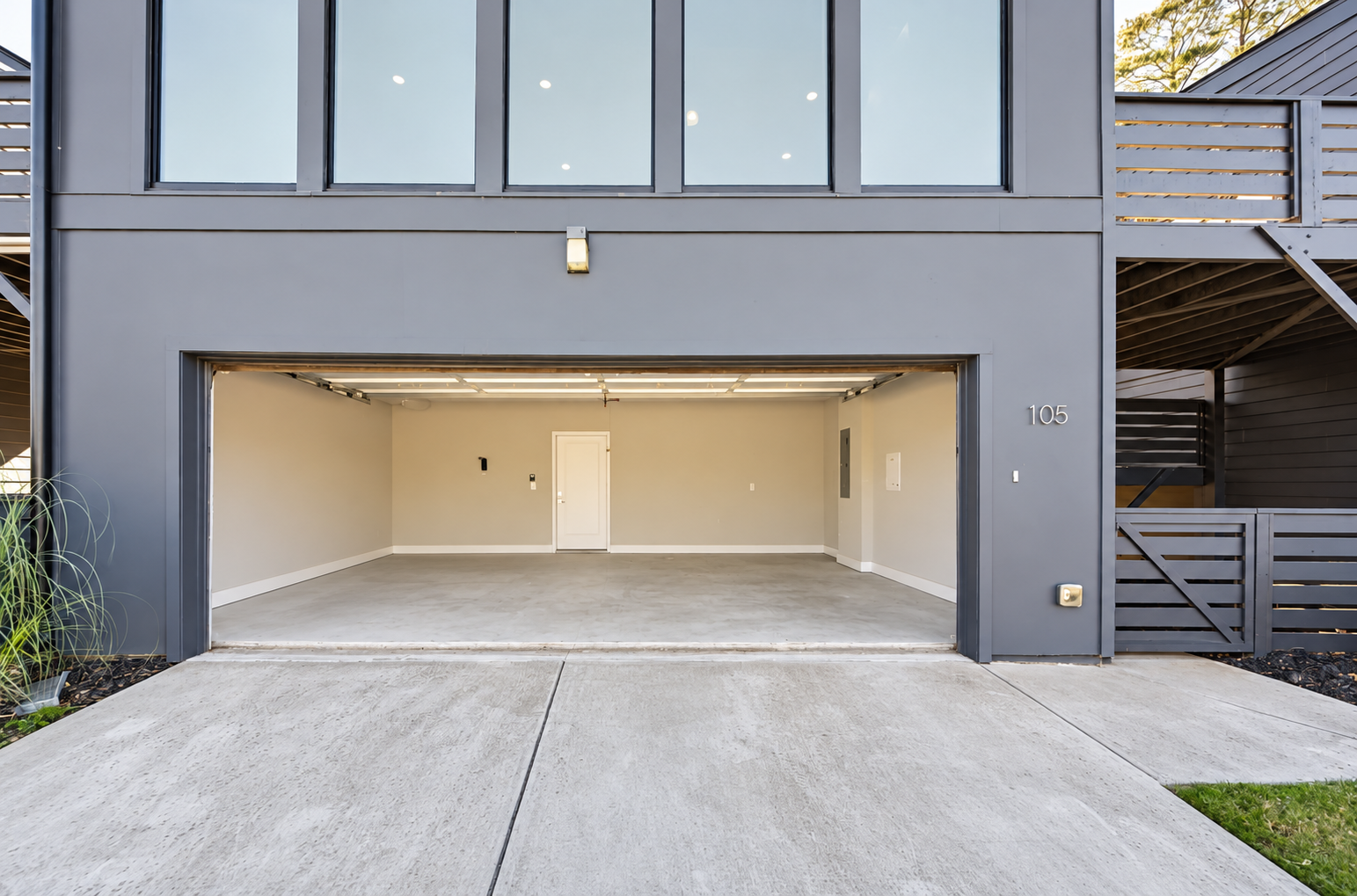 Garage with belongings digitally removed using AI-assisted decluttering and retouching