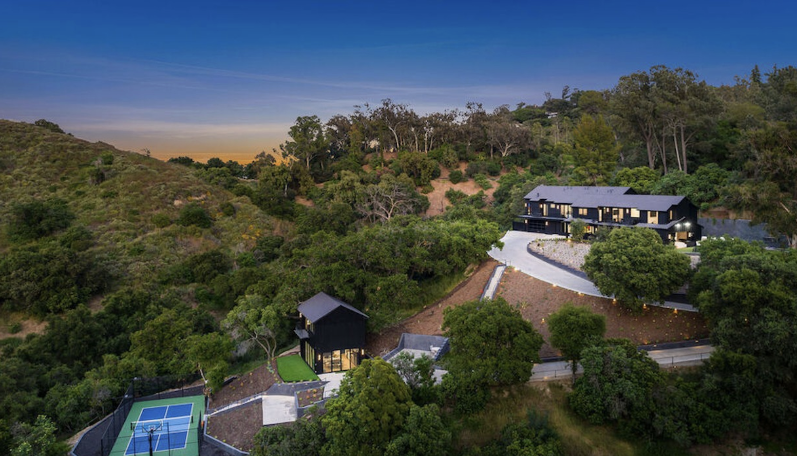 hillside estate on a large wooded lot in Longridge Estates, Studio City, with a guest structure and sport court below