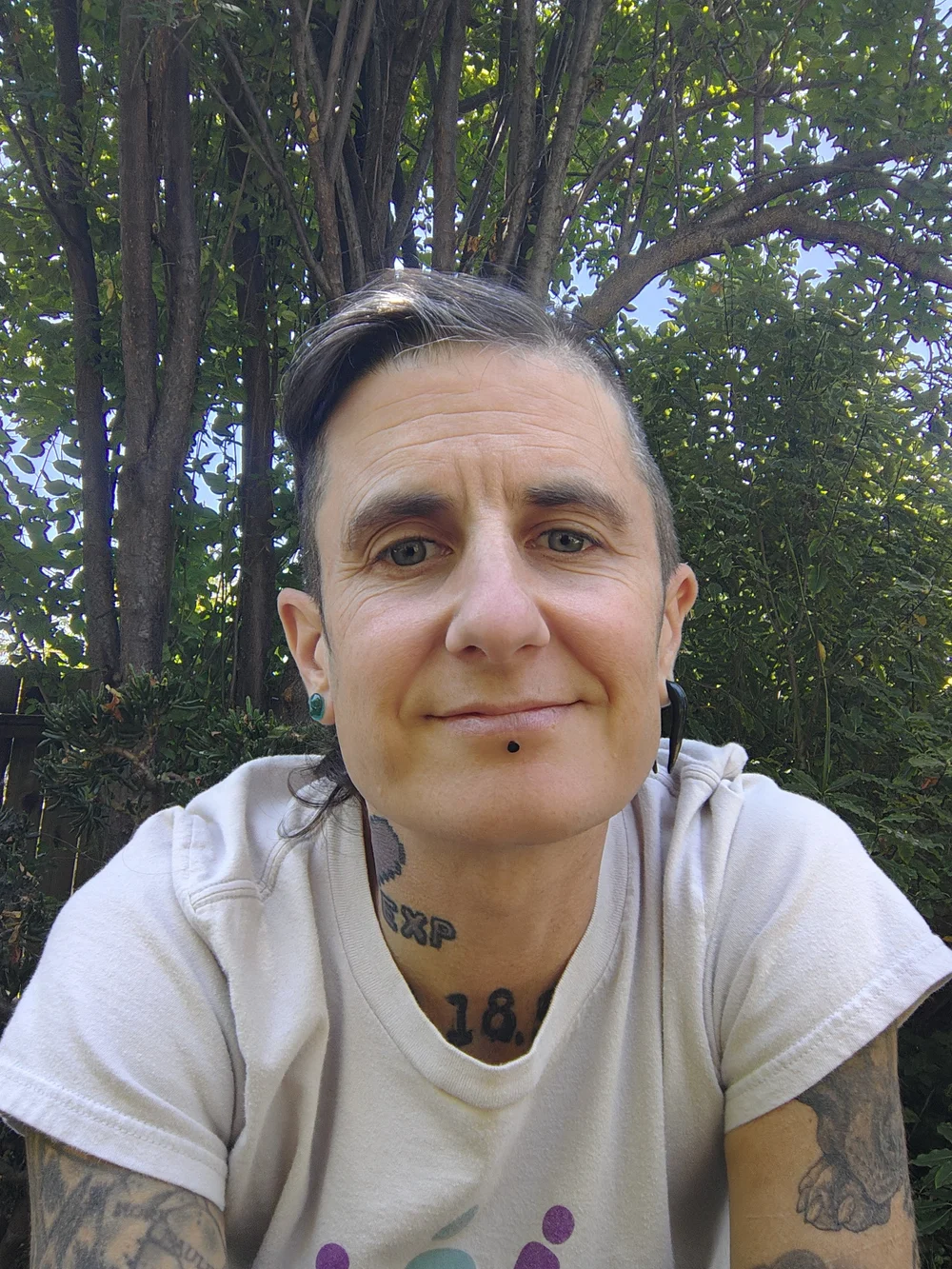 Eli outdoors, looking toward the camera