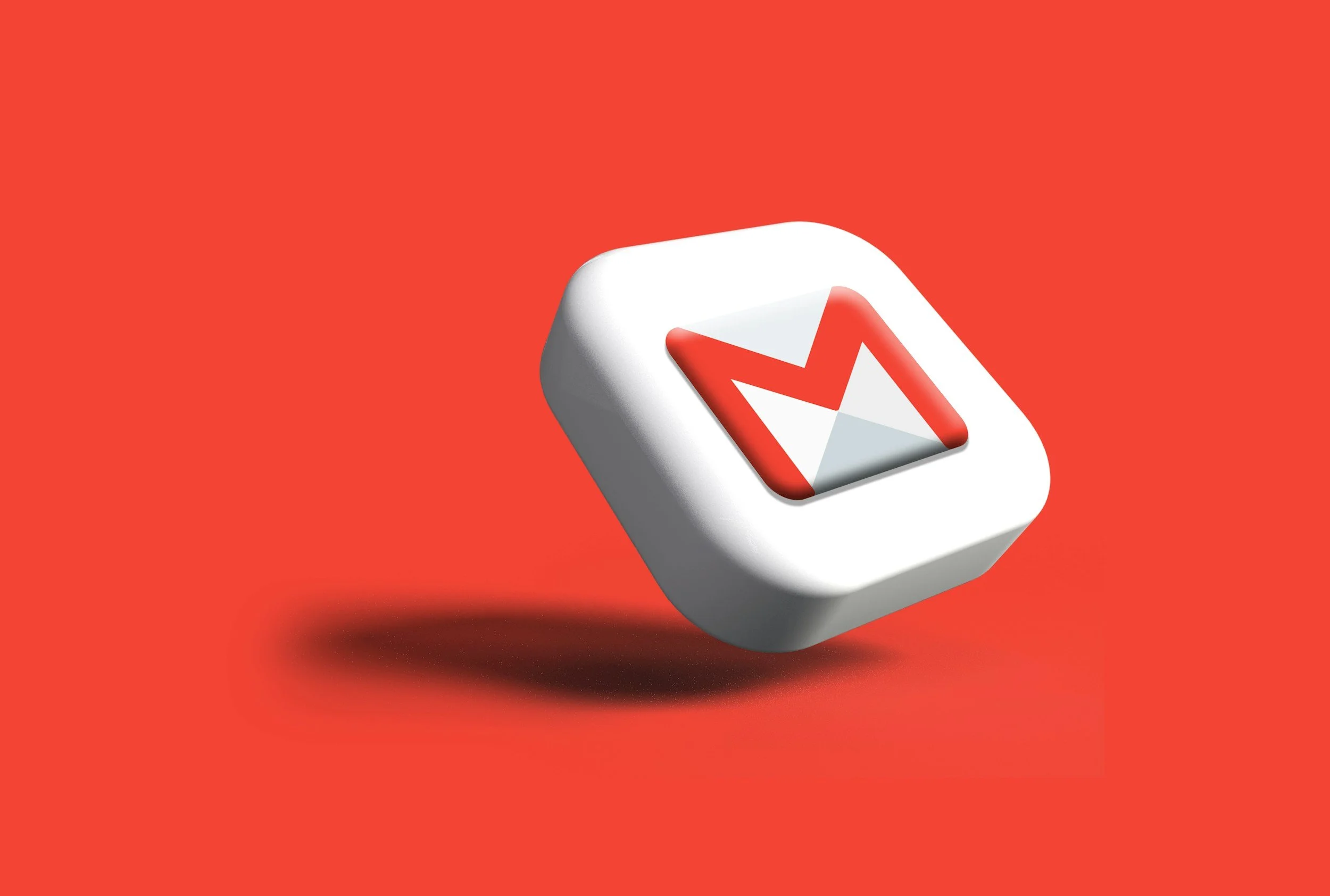 3D rendering of a white square button with the red and white Gmail envelope logo on a red background.