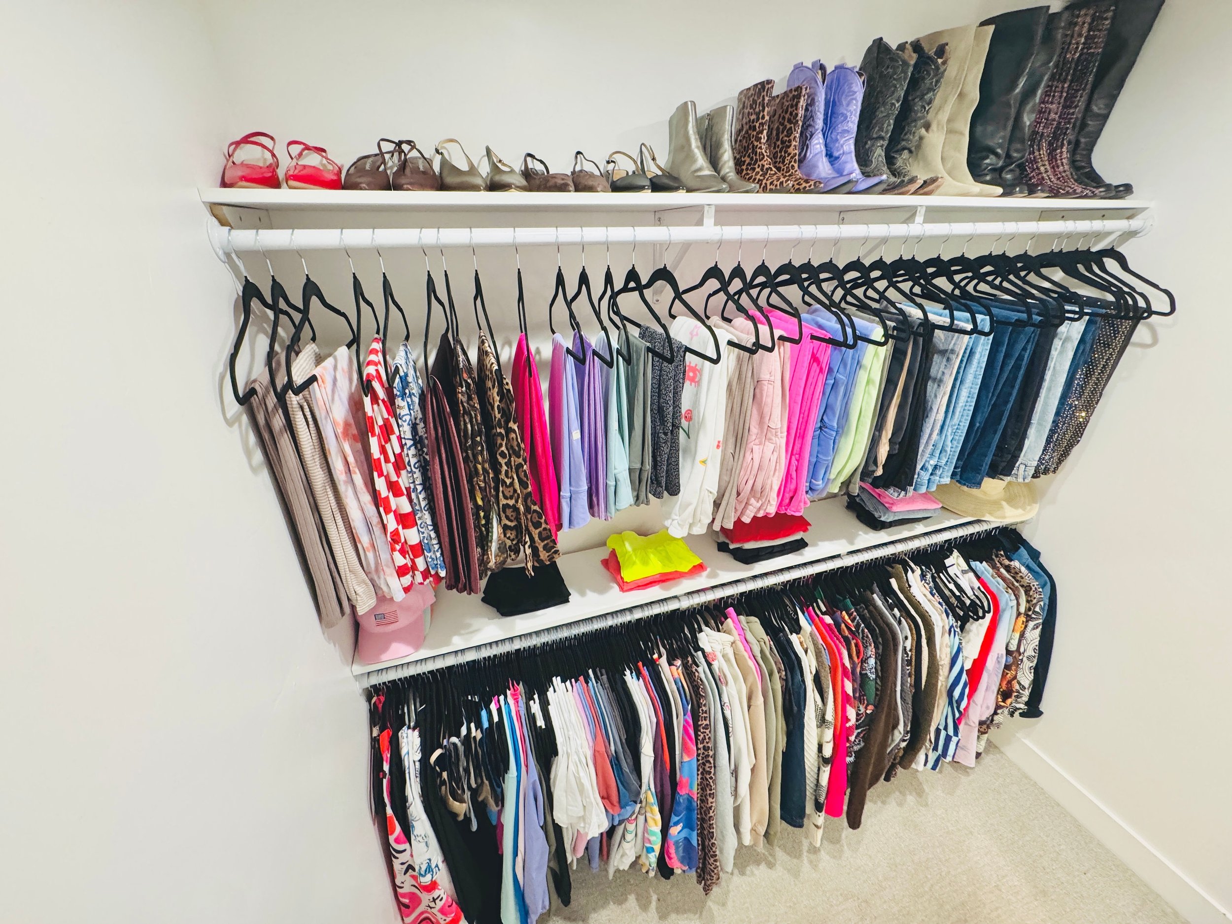 Luxury women’s walk-in closet organization by a professional organizer in Park City.