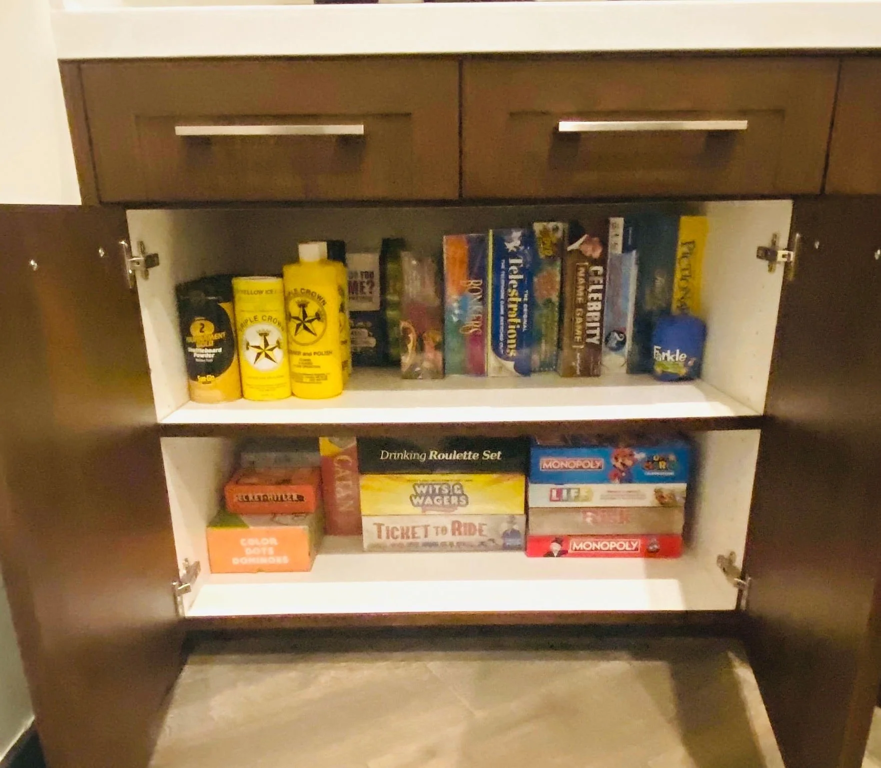 Streamlined game cabinet organization for easy access in a Park City game room.