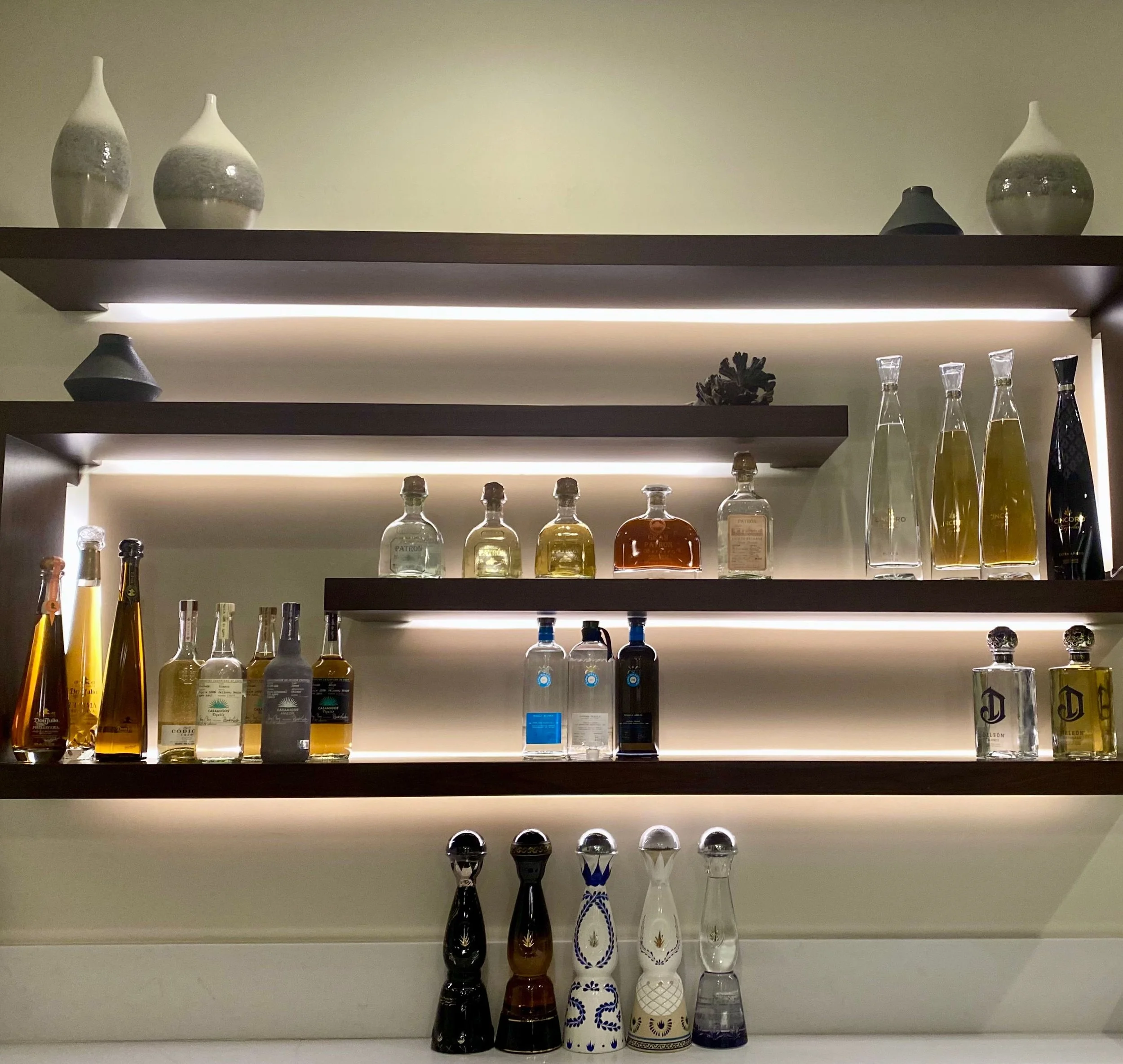 Sophisticated home bar organization and liquor bottle display systems in a luxury Park City residence.