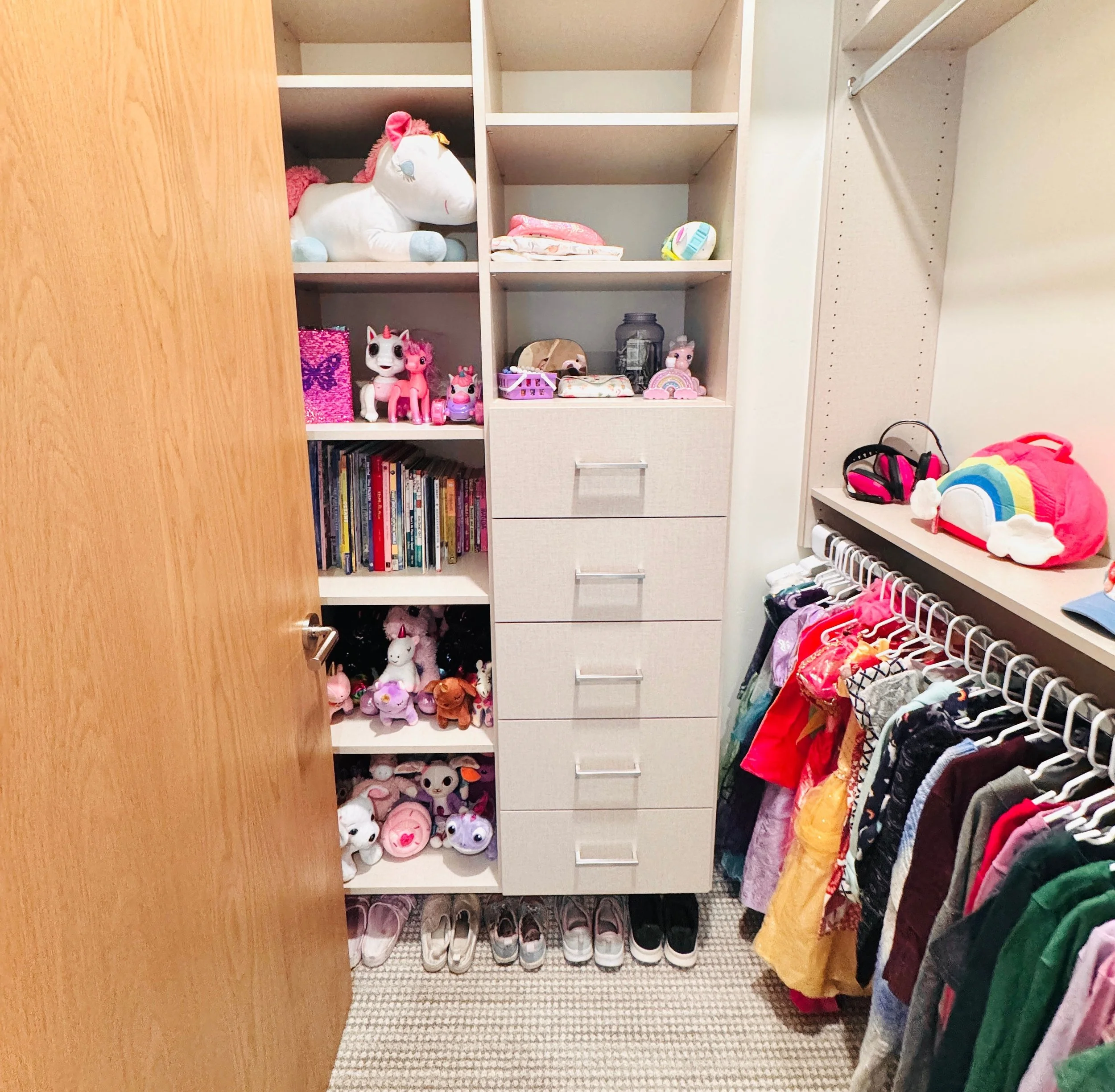 Custom girls' closet organization and bedroom storage solutions in Park City, Utah.