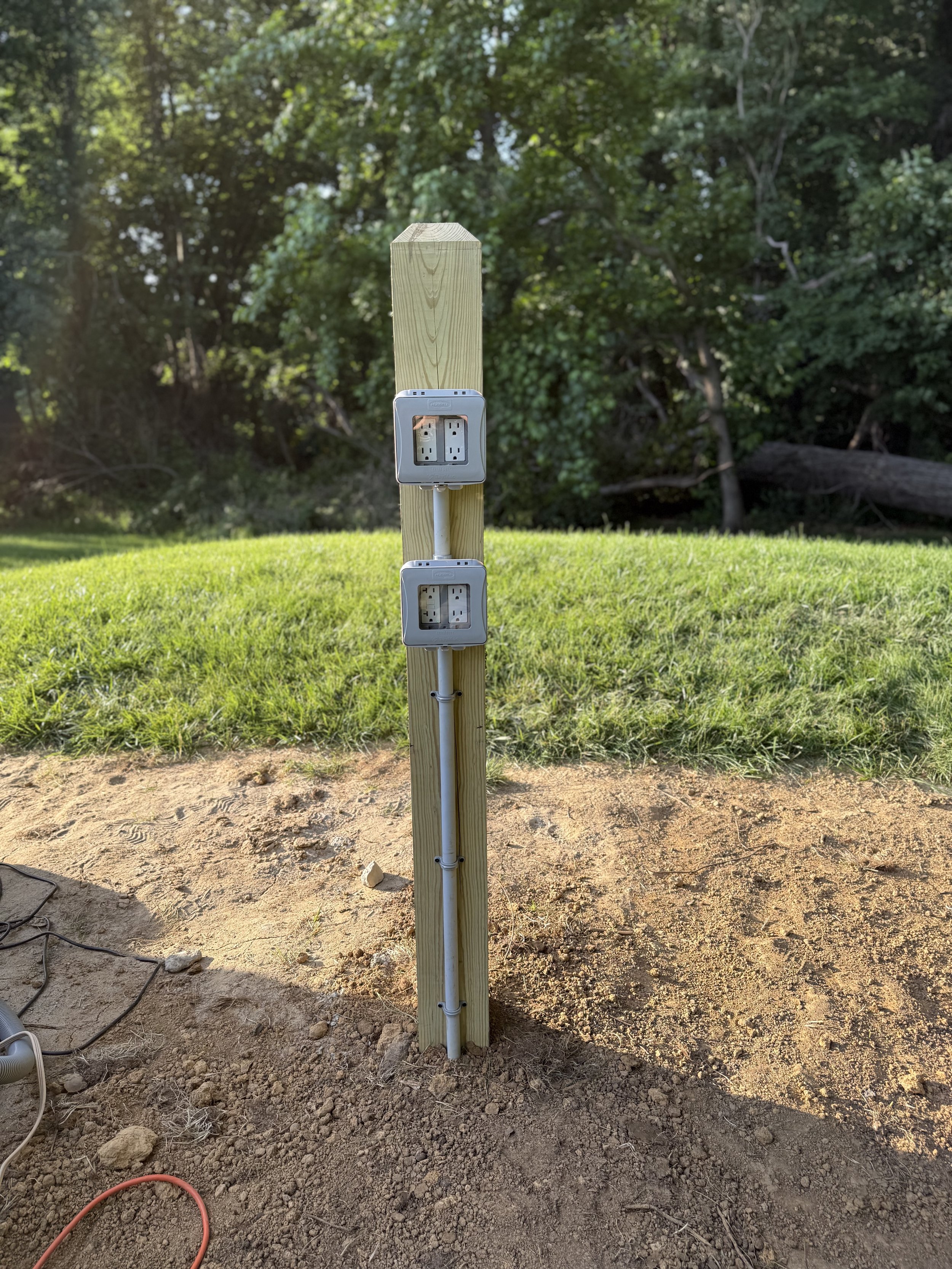 Outdoor electrical service pole installation, weatherproof outlet wiring, and exterior power panel setup by ProVolt Electric in Odon, Indiana.