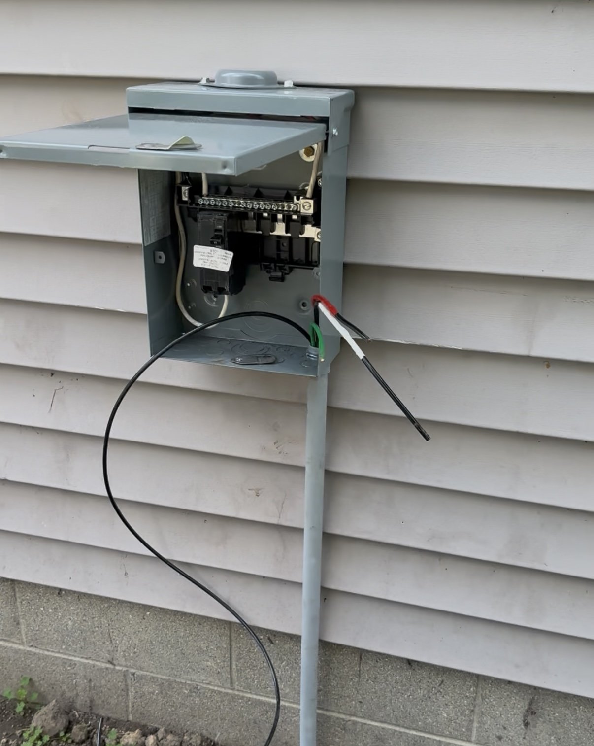 Weatherproof outdoor breaker panel installation, main electrical service disconnect setup, and exterior panel upgrades by ProVolt Electric in Bloomington, Indiana.