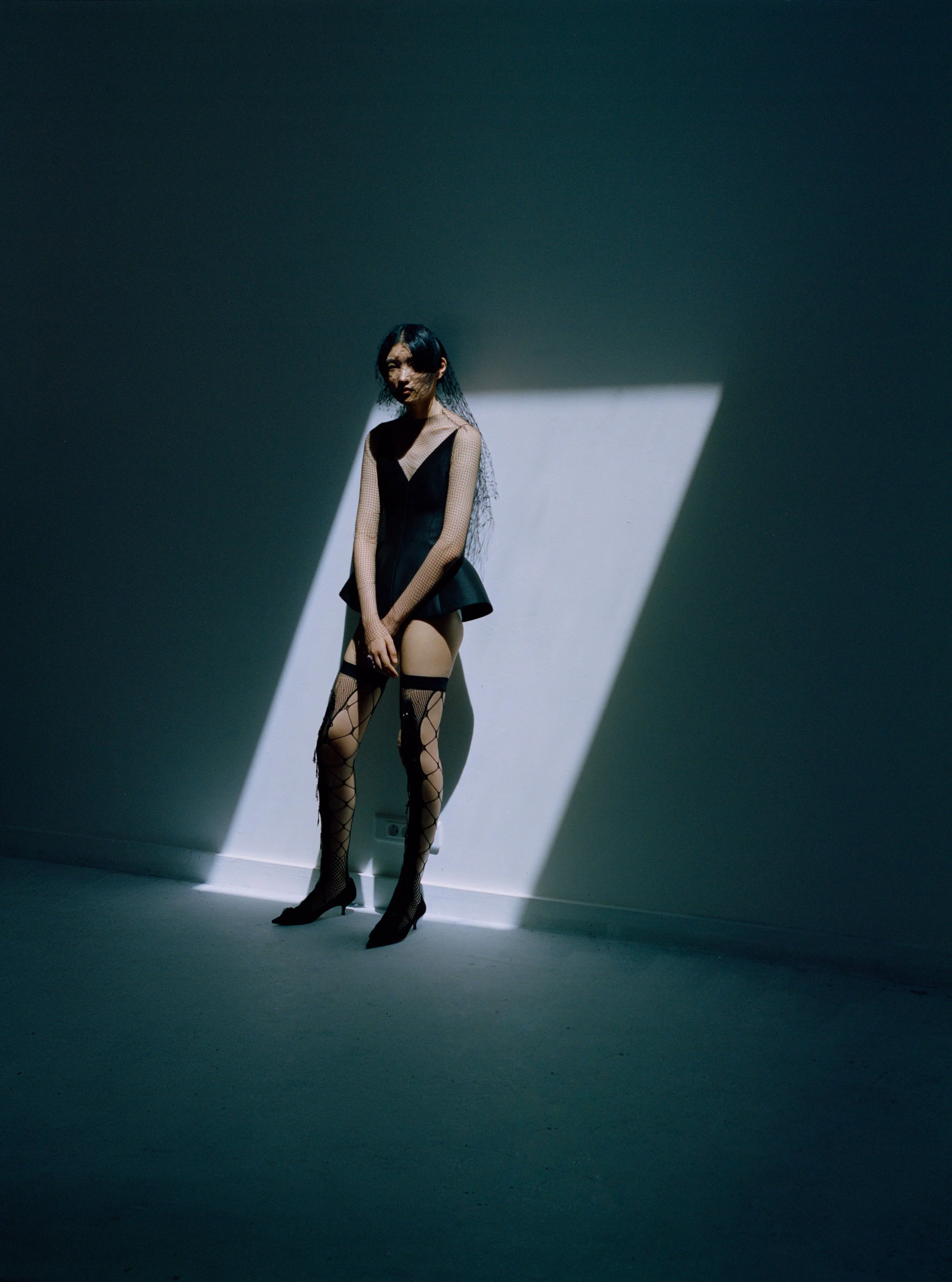 model in studio wearing haute couture