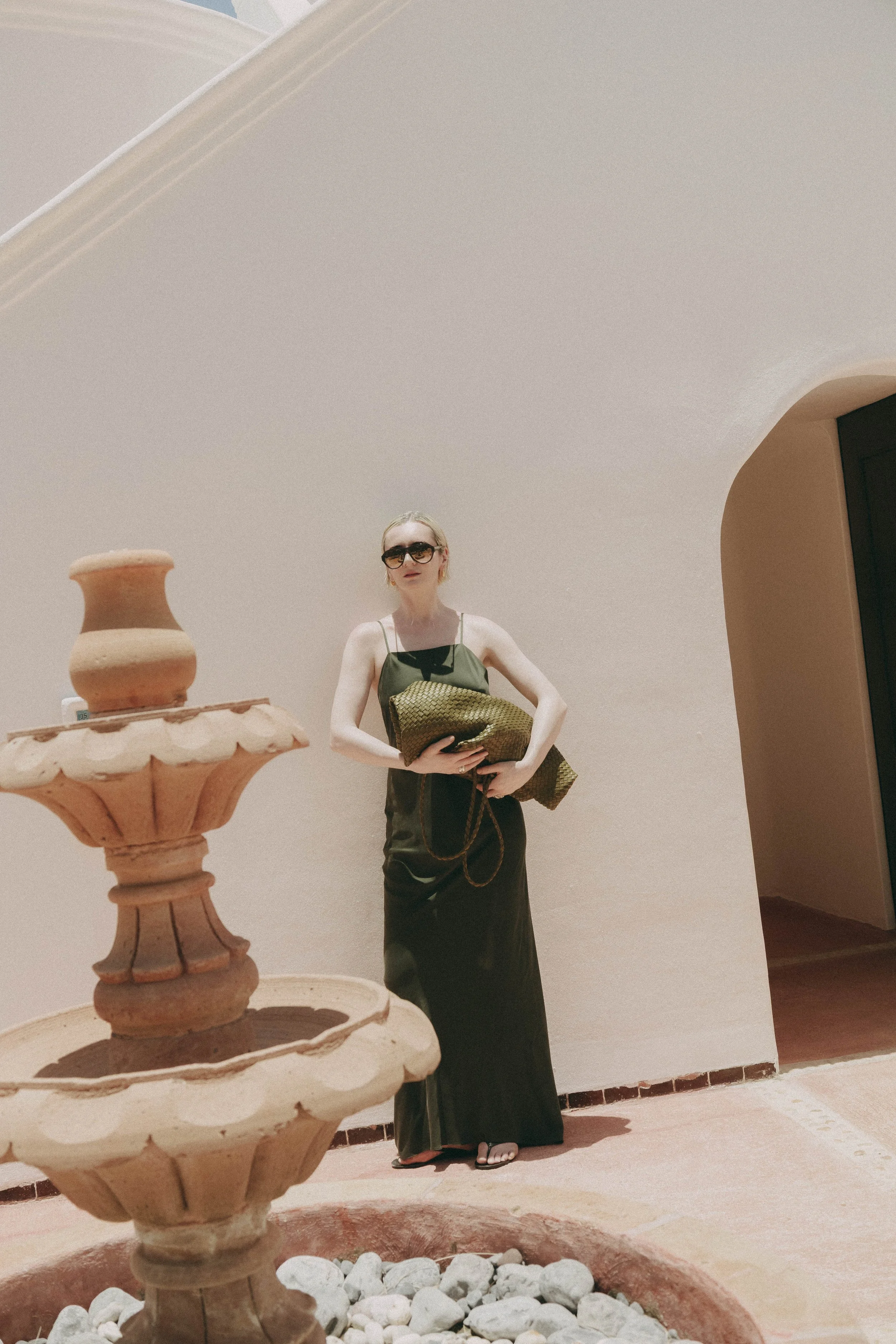women wearing luxury minimal silk dress in unique travel location