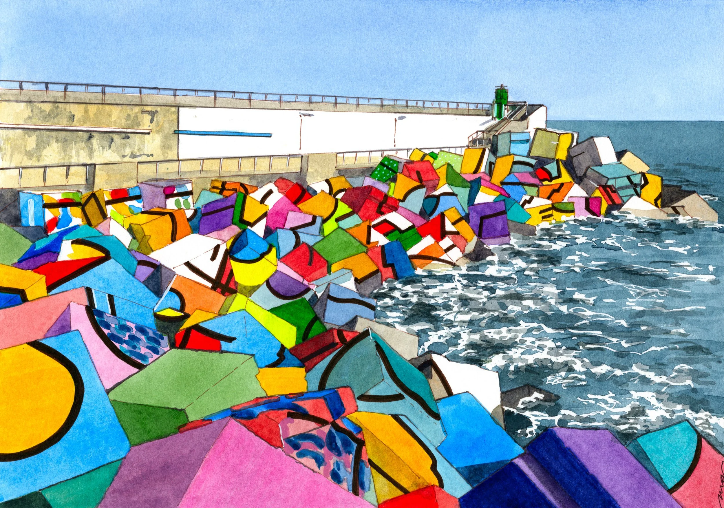 Puente de hormigón con barandillas, junto al mar, con una gran pila de bloques de colores en la orilla